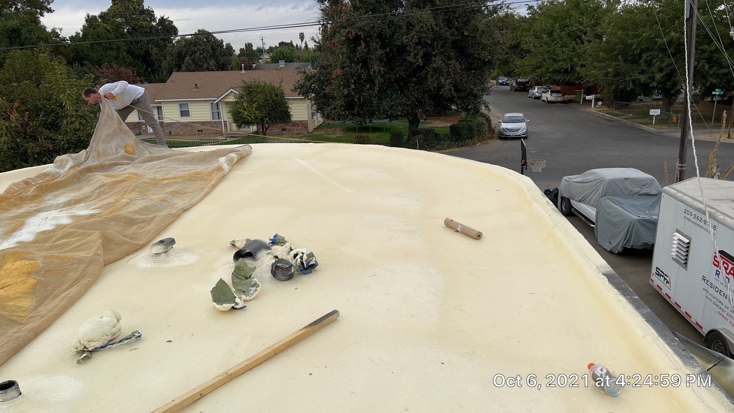 Residential Roofing Installation using Spray foam roofing insulation and General Coatings acrylic coatings by Straight Edge Roofing Inc