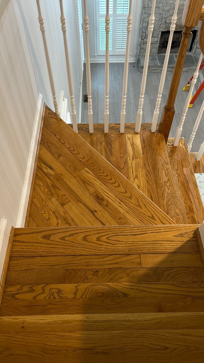 Updated staircase and hallway by Footprints Floors of Nashville