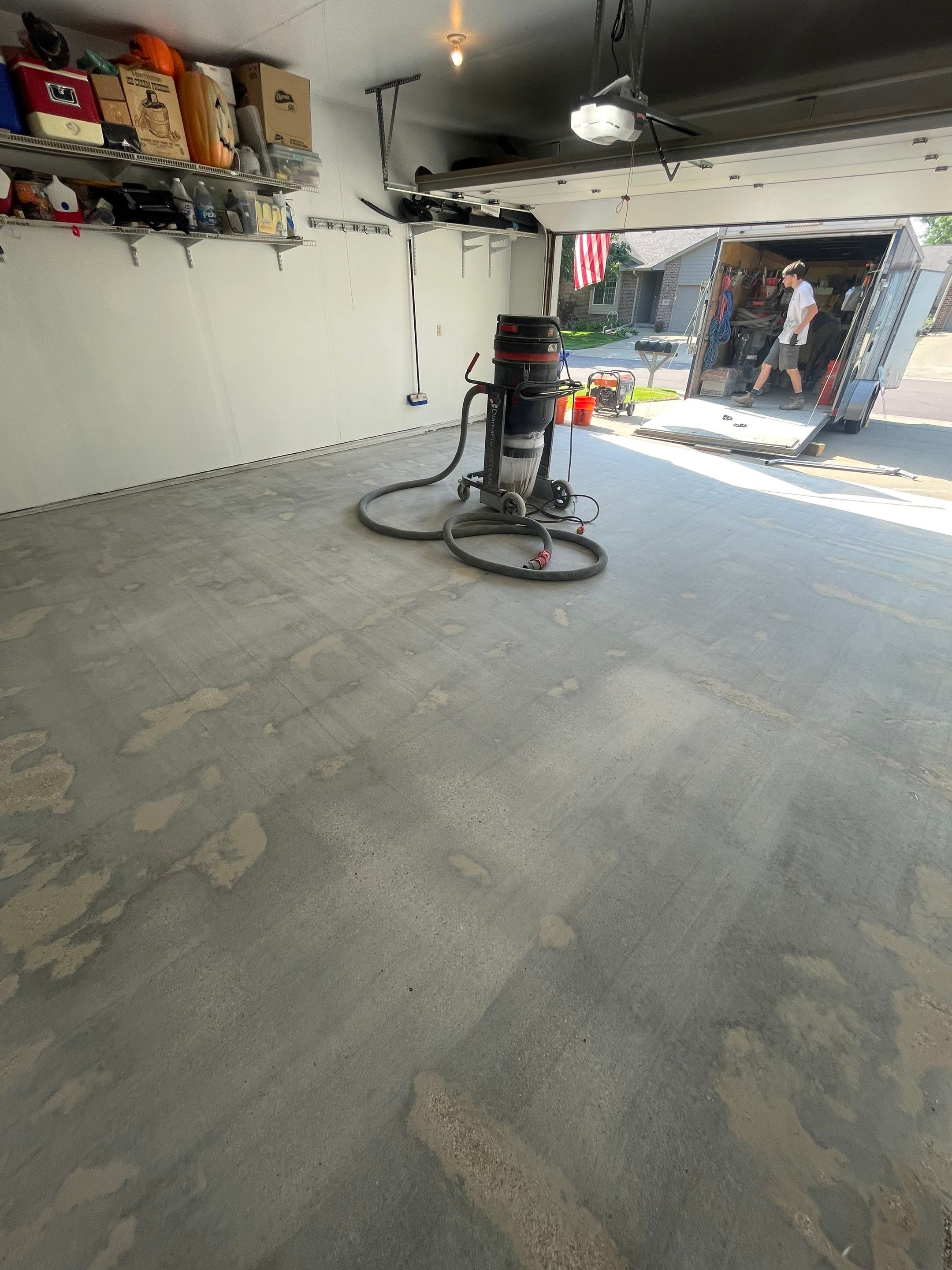 Sioux Falls Residential Garage Floor Coating with Speckled Epoxy Finish by Select Painting, Coatings & Garage Cabinets