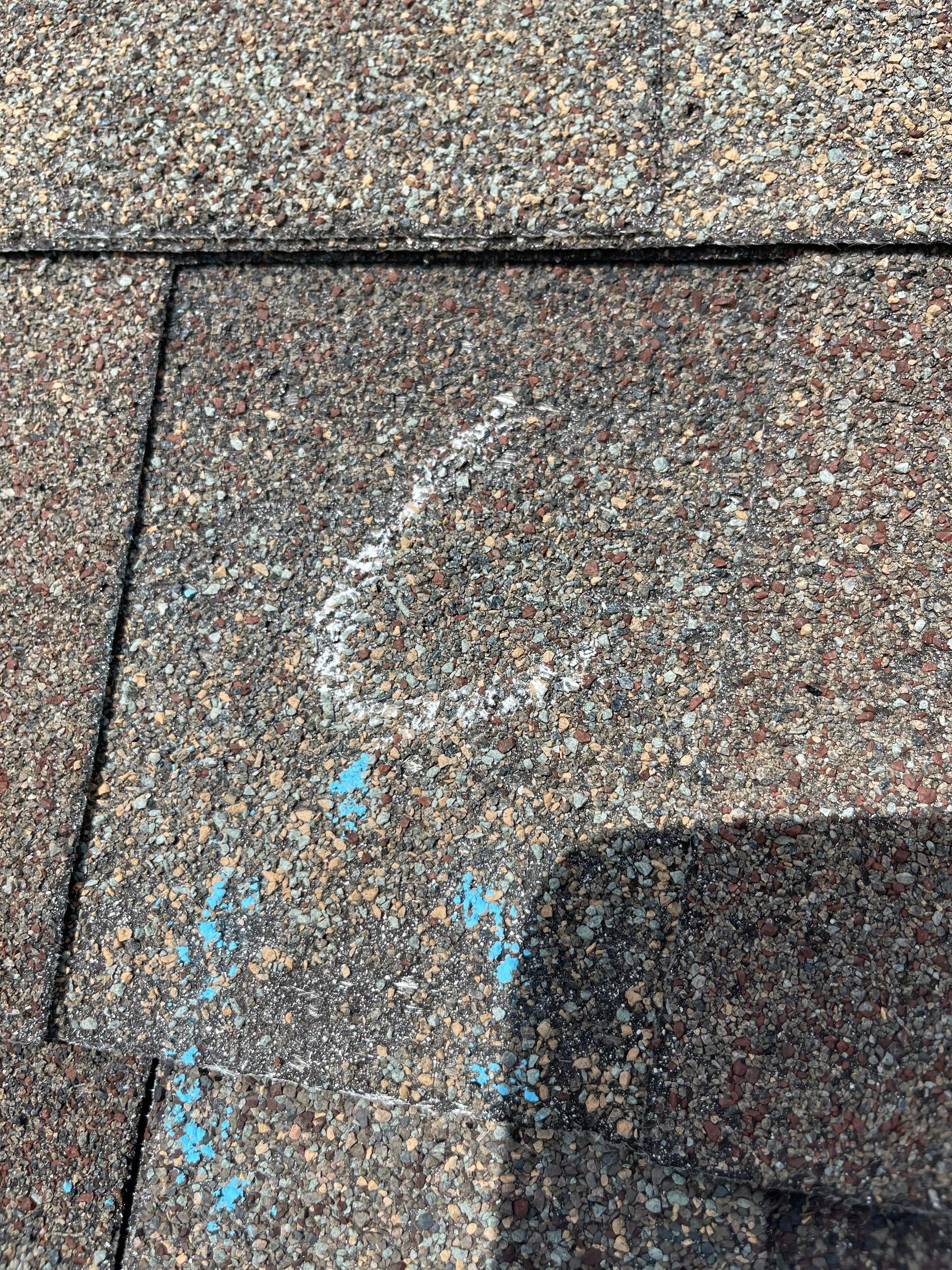 Hail Damage on a Roofing System by Icon Roofing And Construction 