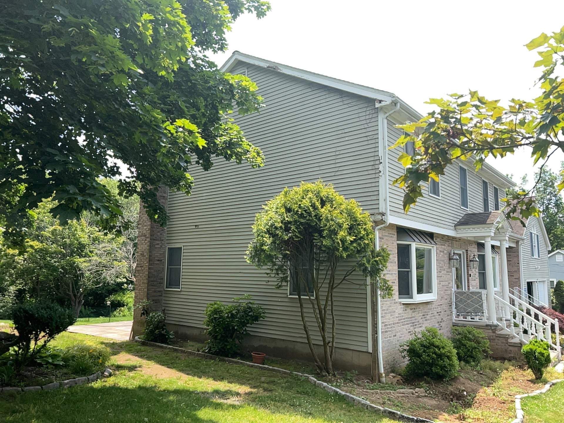 Siding Installation using Mainstreet Colonial & White gutters by A Plus Exterior