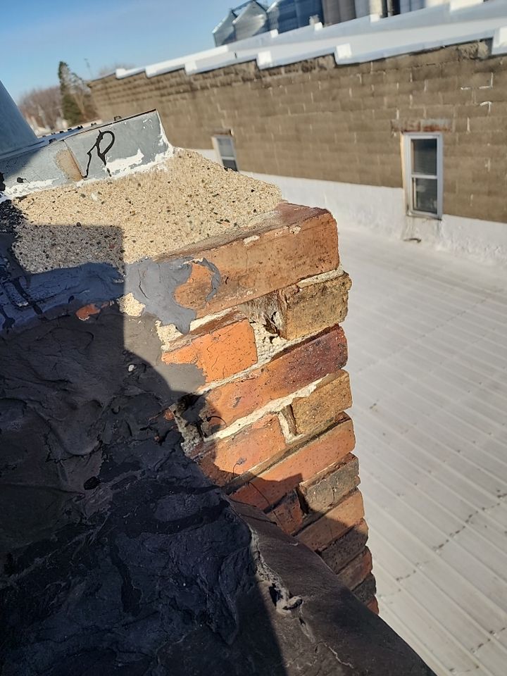 Recover of a downtown building  by Grell Roofing, LLC