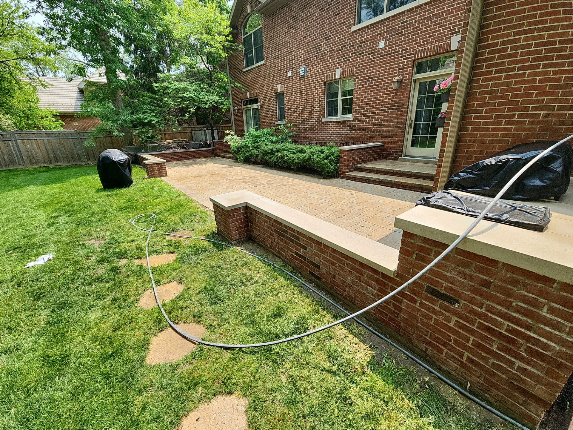 Brick paver repair, clean, seal and poly sanding by Northern Power Washing LLC.