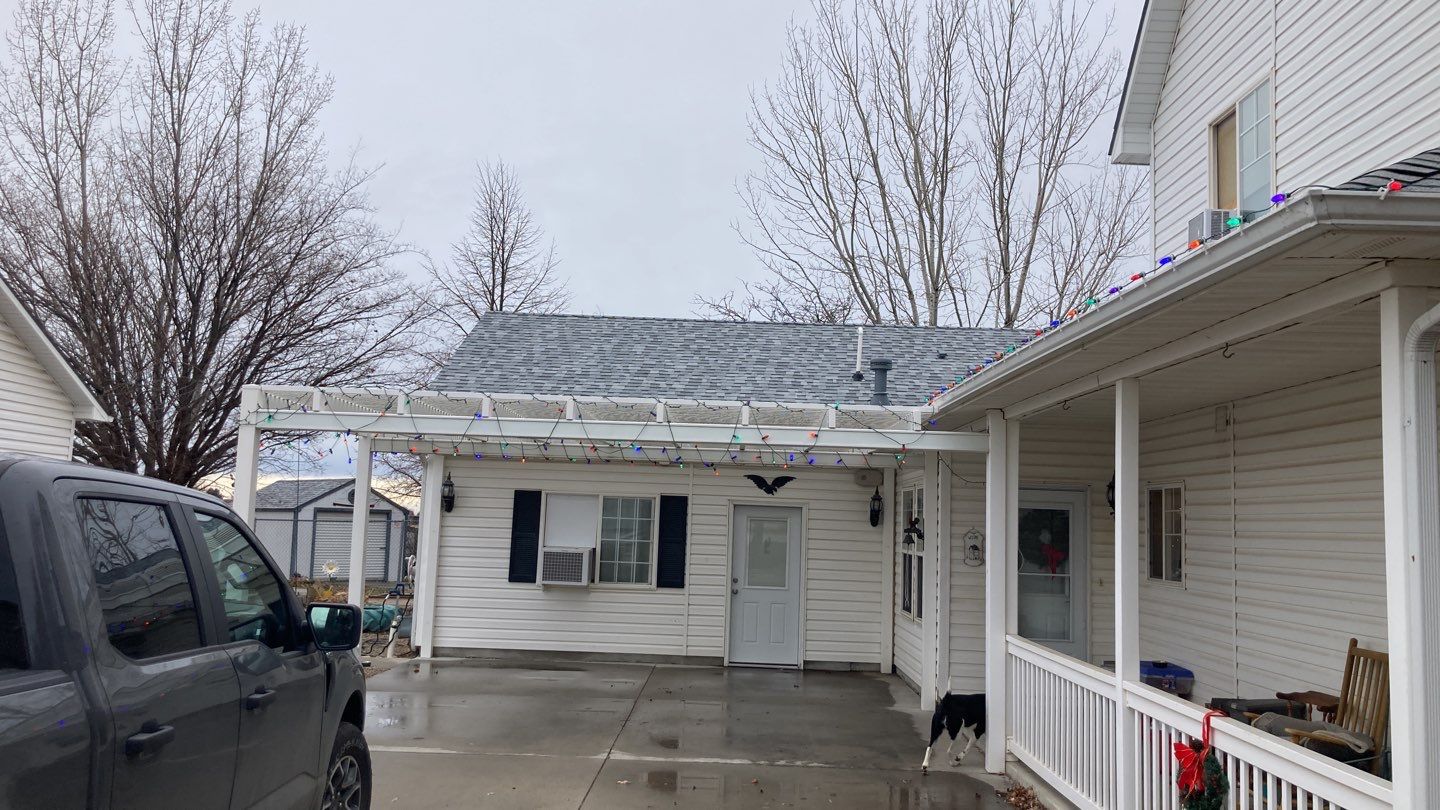 Two story farmhouse style roofing installation using Owens Corning Duration in the color Teak by ID Roofing LLC