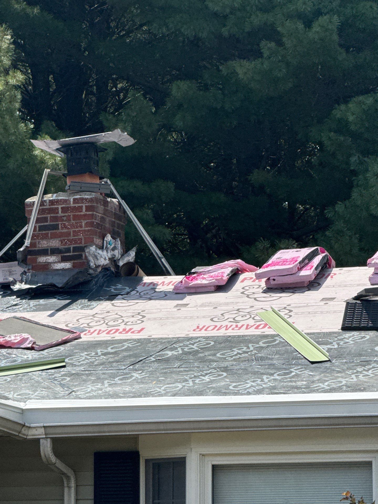 Complete Roof Replacement with Chimney Flashing, Gutter Guard System, and Vinyl Siding Repairs by Mighty Dog Roofing of Greater Middlesex County