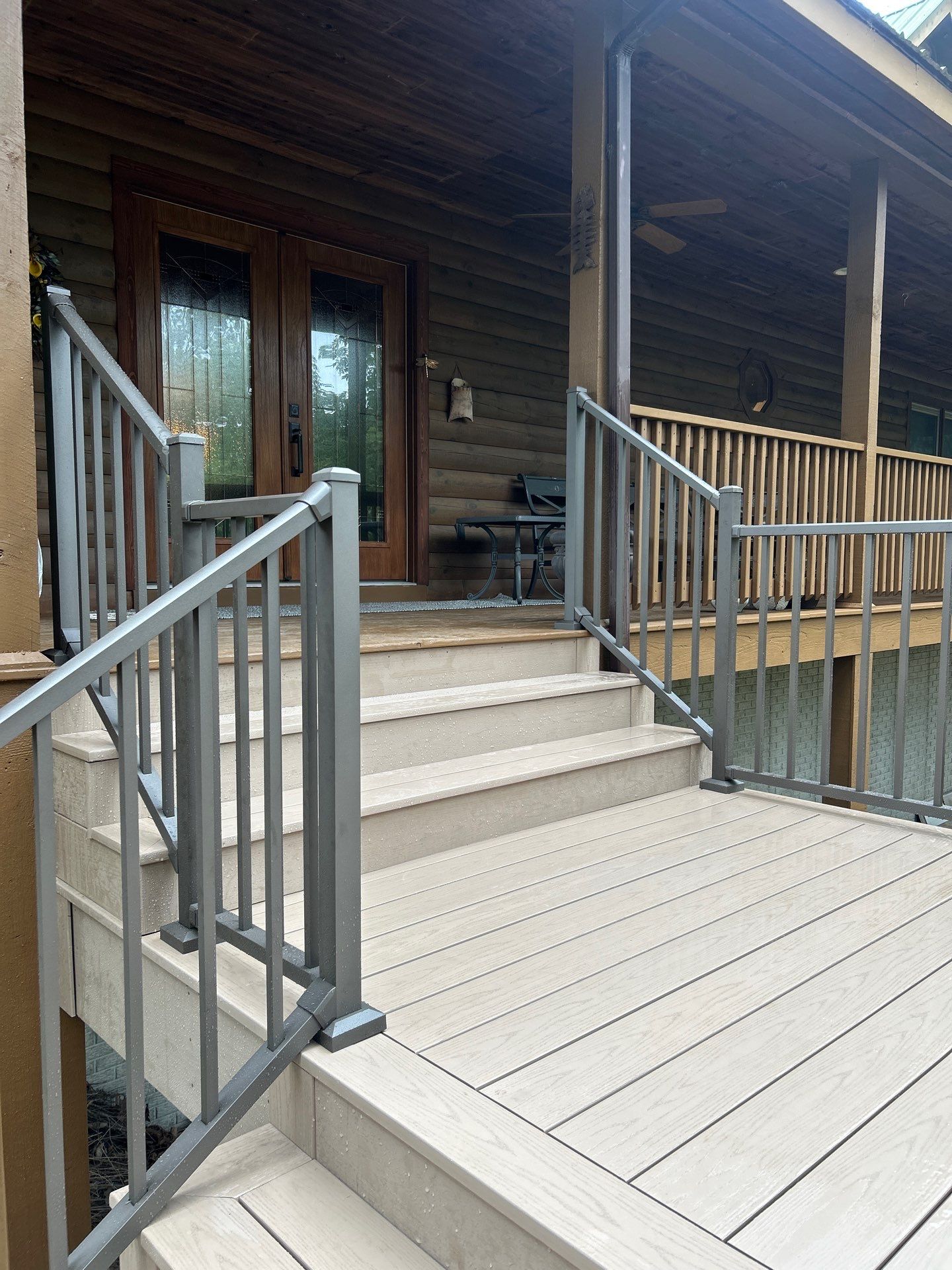 Log Cabin Wrap-Around Deck and External Staircase Installation in Caldwell by Walnut Hollow Decks & Outdoor Living