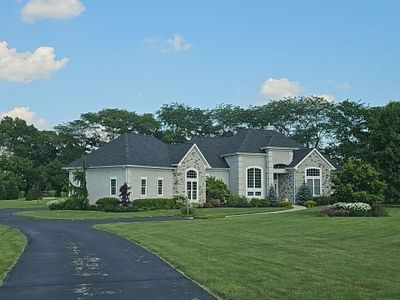 Residential Roofing Installation using Atlas Pinnacle Black Shingles