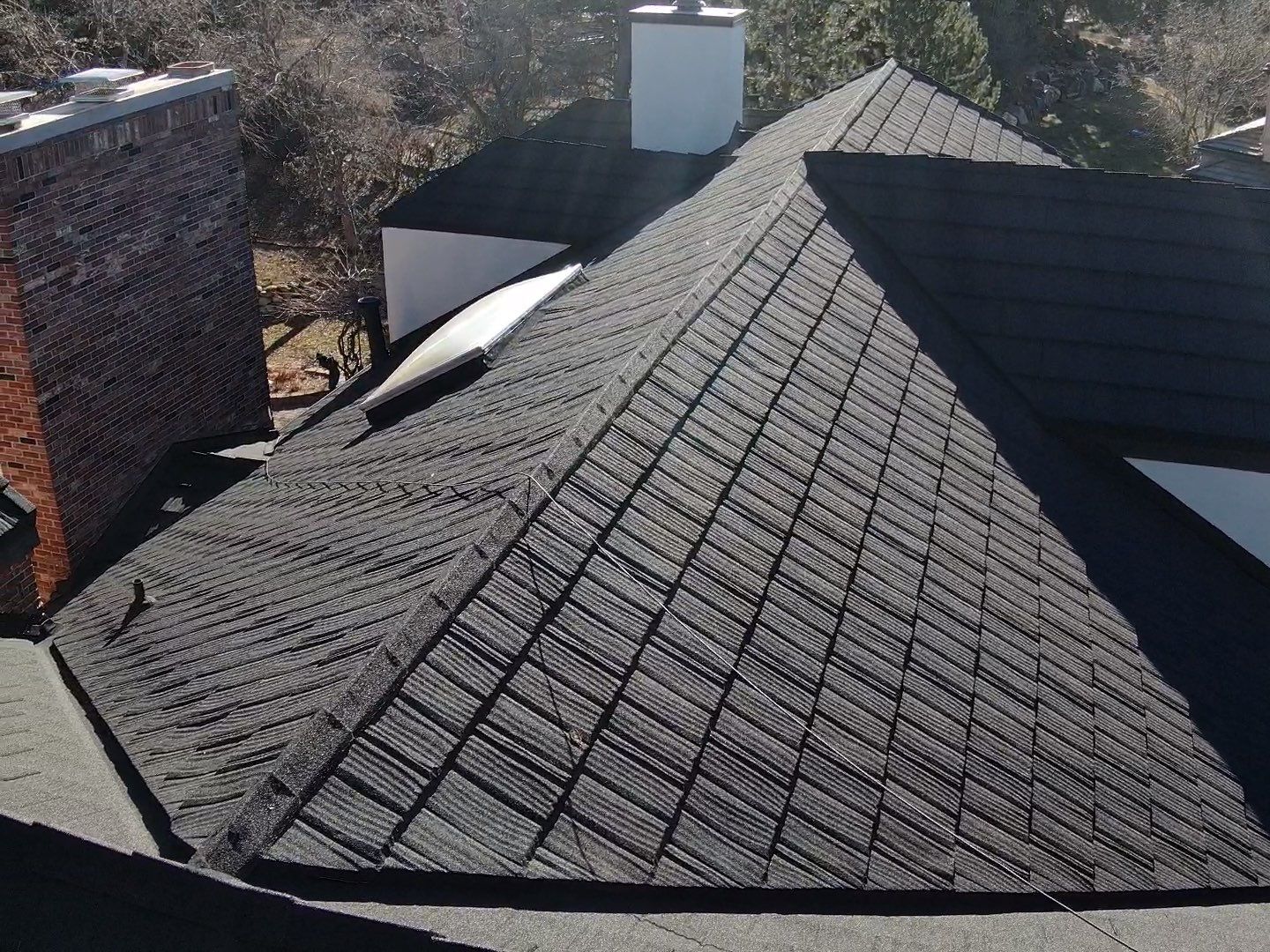 Unified Stone Coated Roof & Stucco Remodle by Blue Peaks Roofing LLC