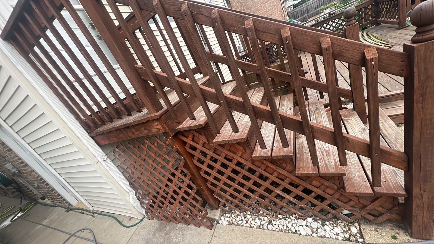 Wood cleaning and staining using Armstrong cloark oil stain by Northern Power Washing LLC.