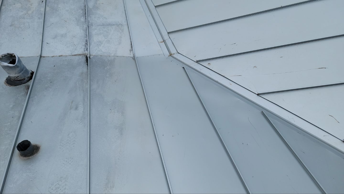 roof washing using Algaecide, soft wash soap by Northern Power Washing LLC.