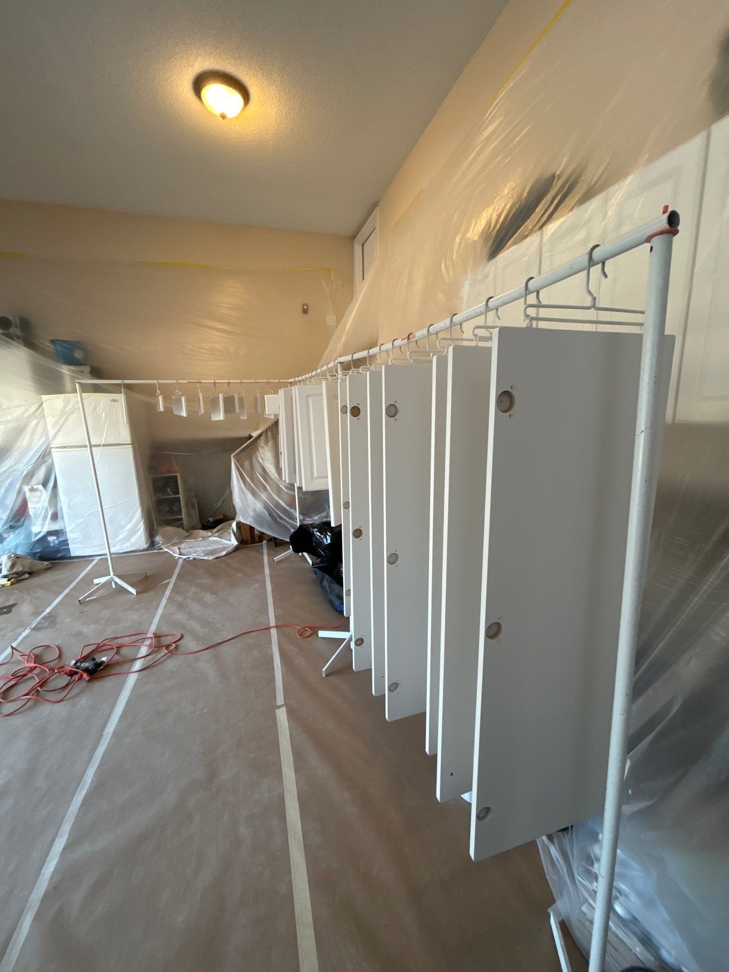 Cabinet painting by GonzalezPainters & Contractors Inc 