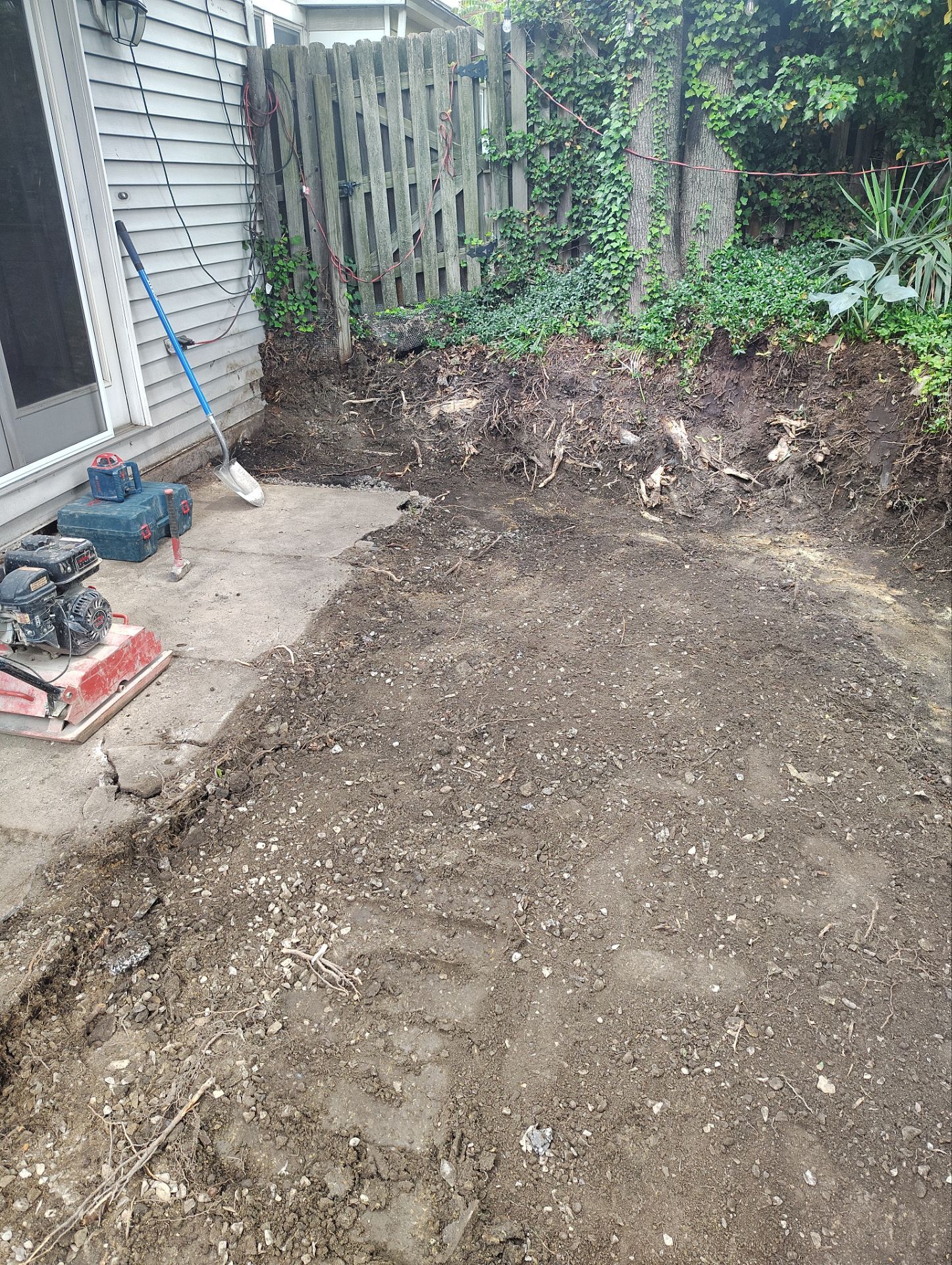 Stamped Concrete and Retaining Wall by Cousins Roofing Siding & Decks