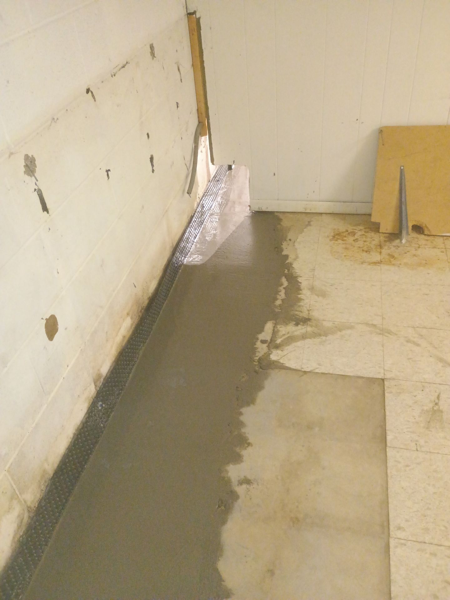 Interior Drain Tile Installation in Columbia Heights, MN by Waterproofing Northeast