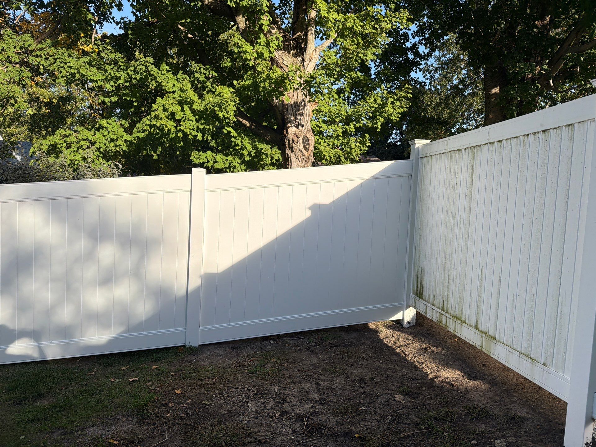 White Vinyl Privacy Fence and Gate Installation in Grundy Center by Perfect Picket Fence and Stain