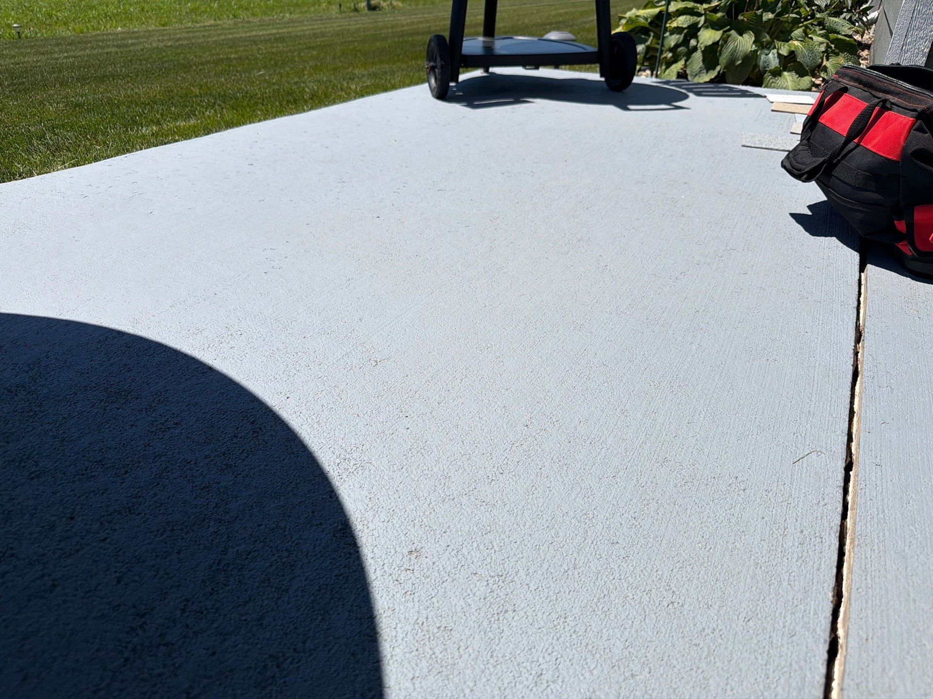 Starry Evening Concrete Patio Coating Installation in Tea by Select Painting, Coatings & Garage Cabinets