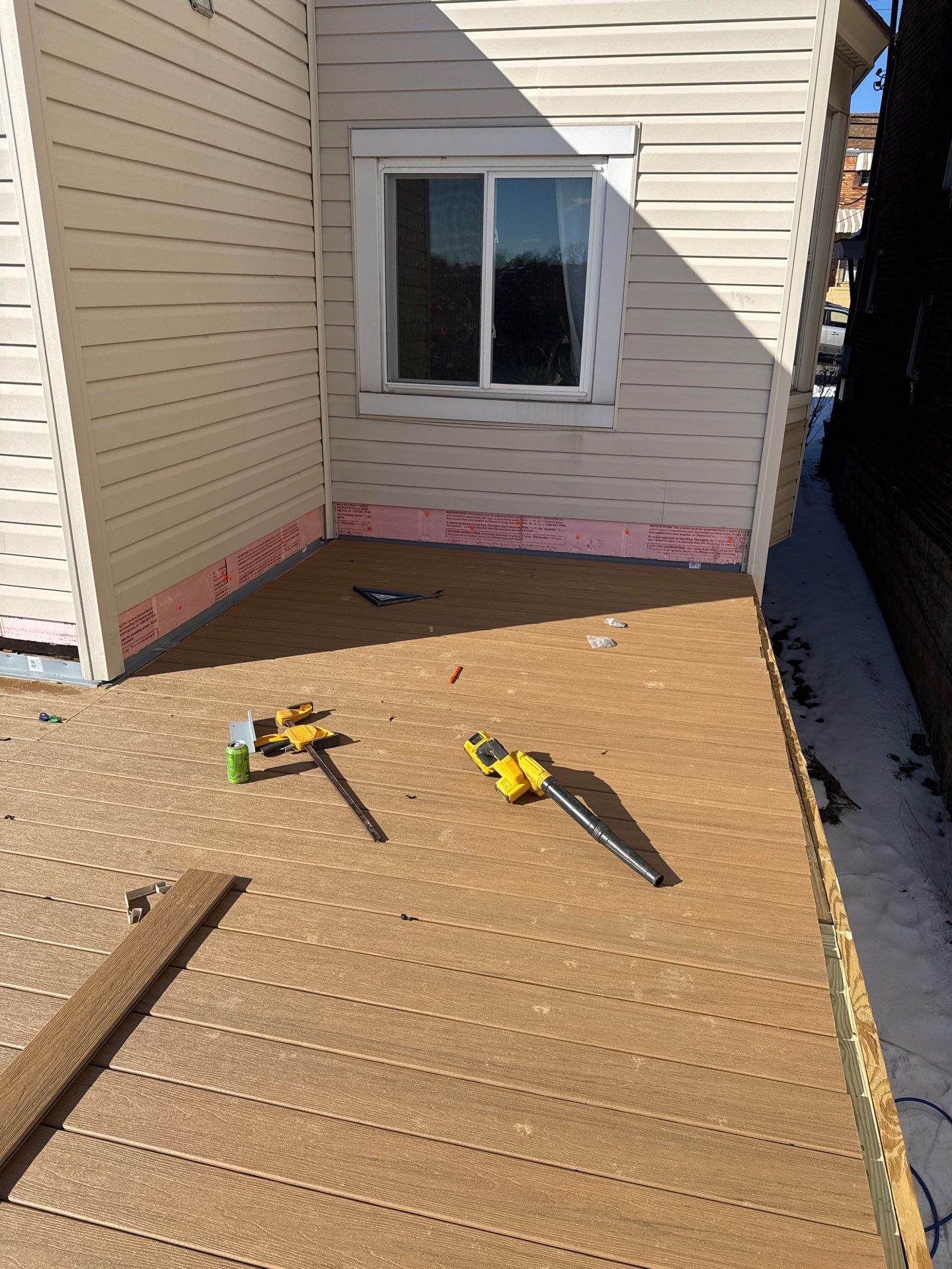 Deck and door by Cousins Roofing Siding & Decks