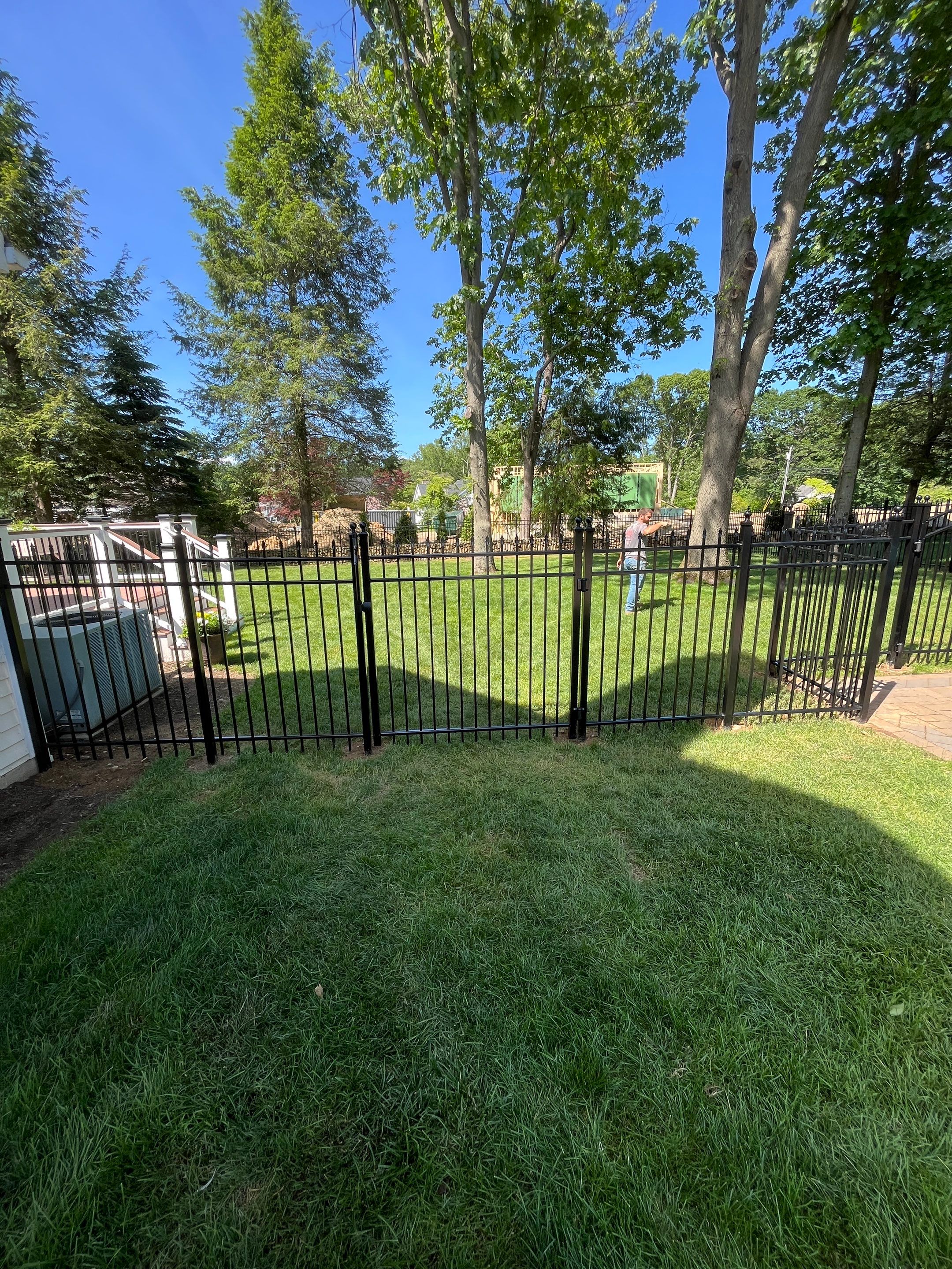 New Black Aluminum fence with matching gate by DiGiorgi Roofing and Siding Inc
