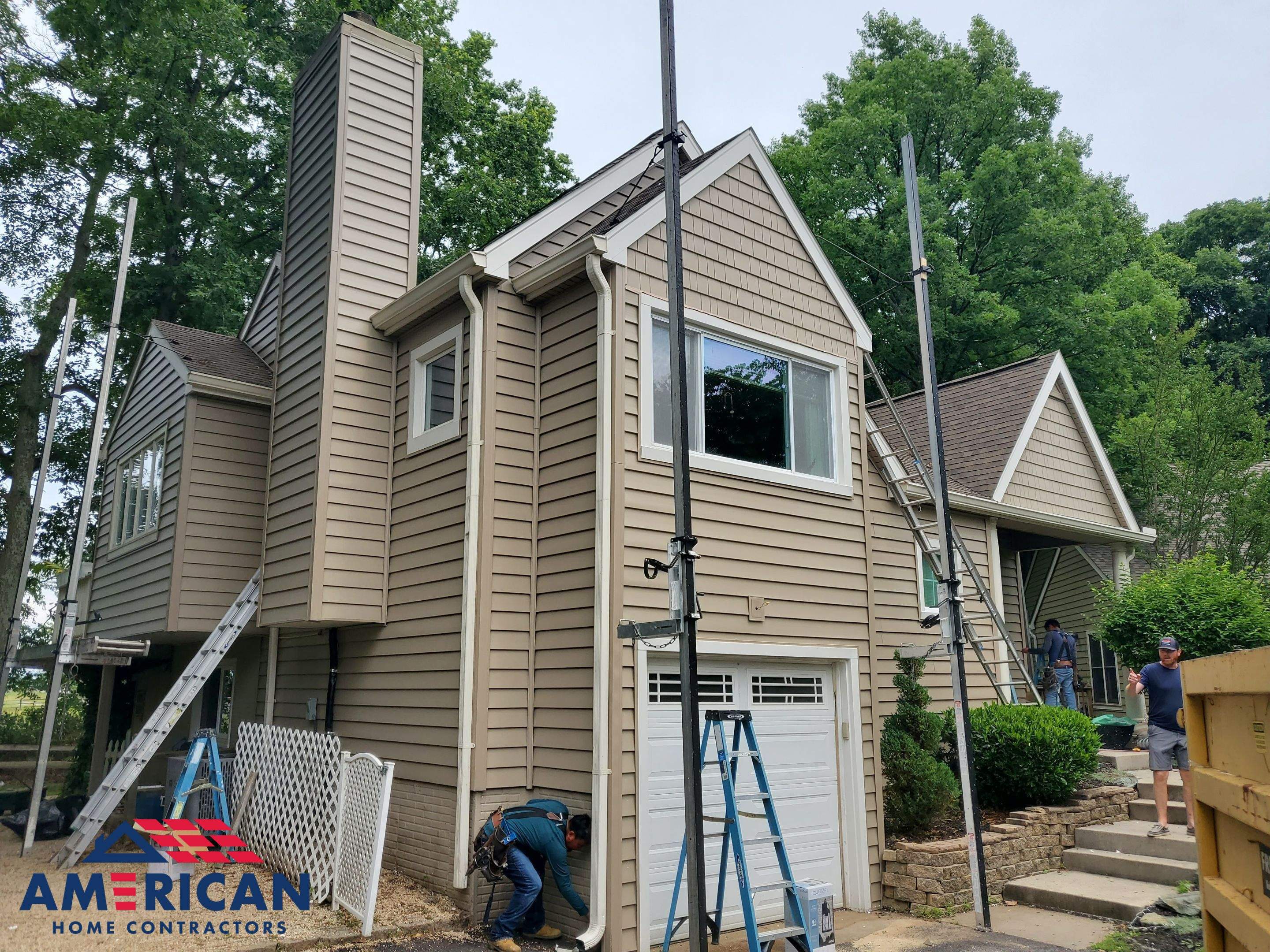 Mastic Siding + Interstate Windows by American Home Contractors