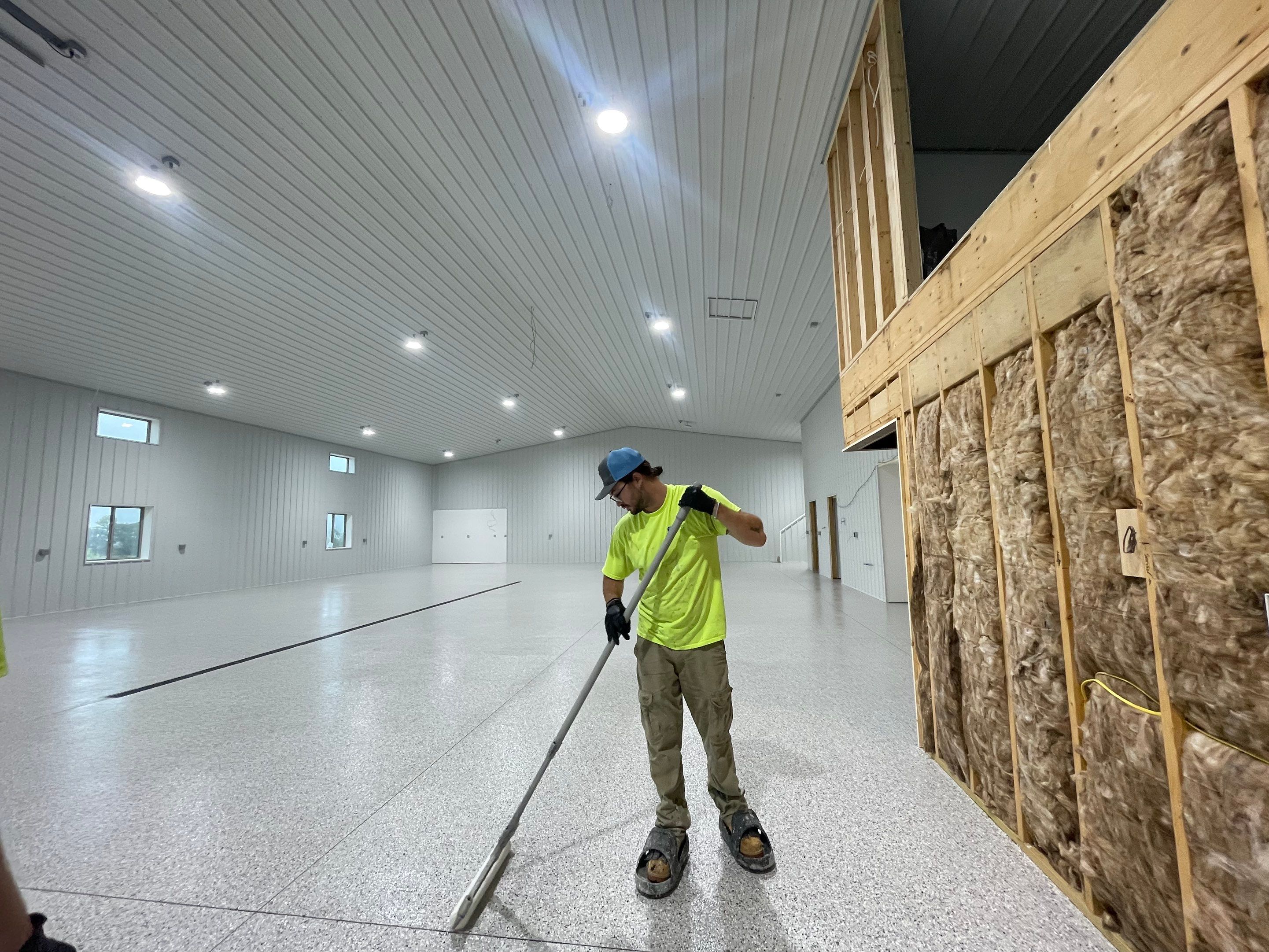Custom Speckled Floor Coating for Large Montrose Shop by Select Painting, Coatings & Garage Cabinets