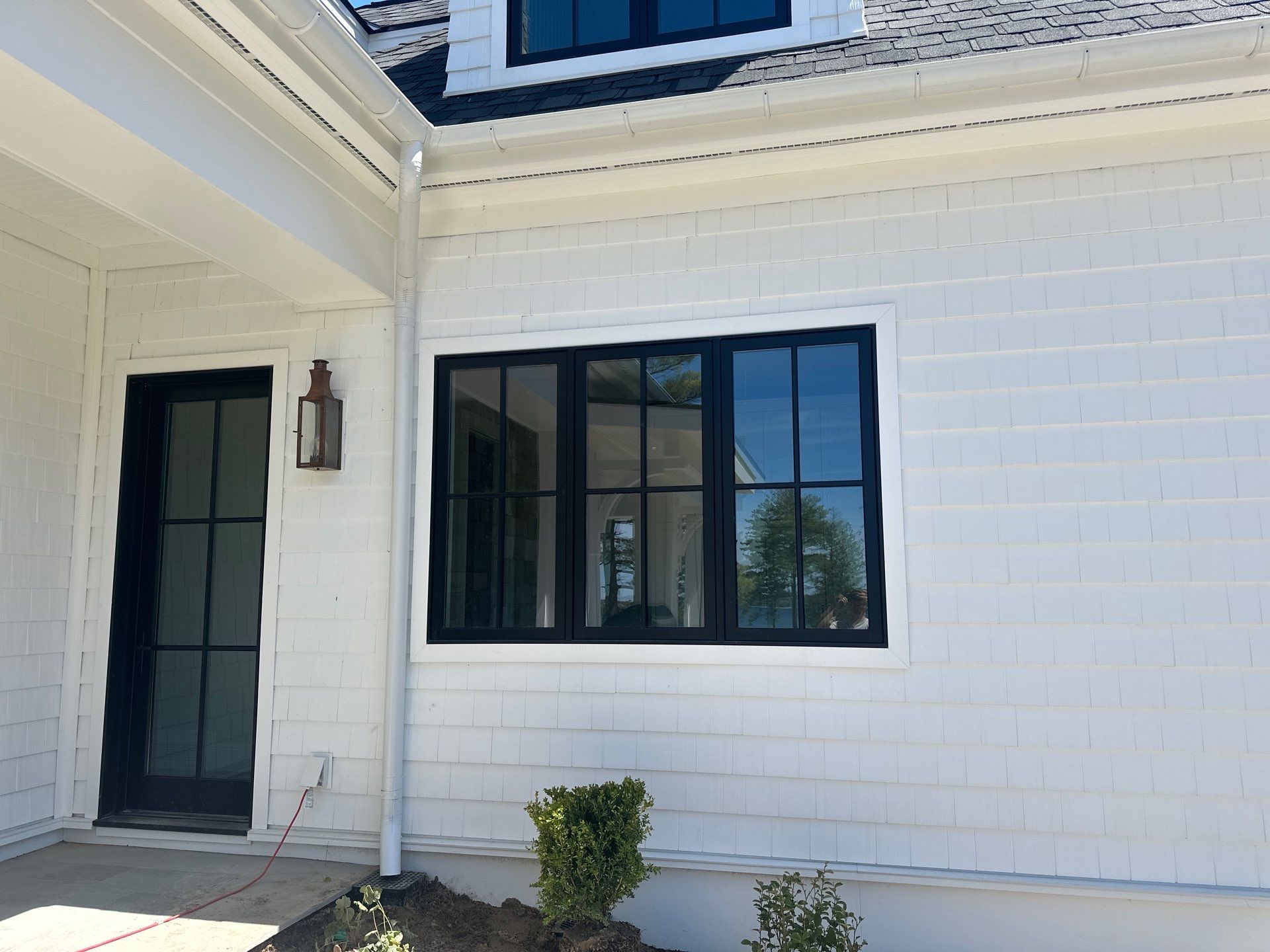 Gutter System and Exterior Drainage Installation in Charlevoix by Rainbow Seamless Systems