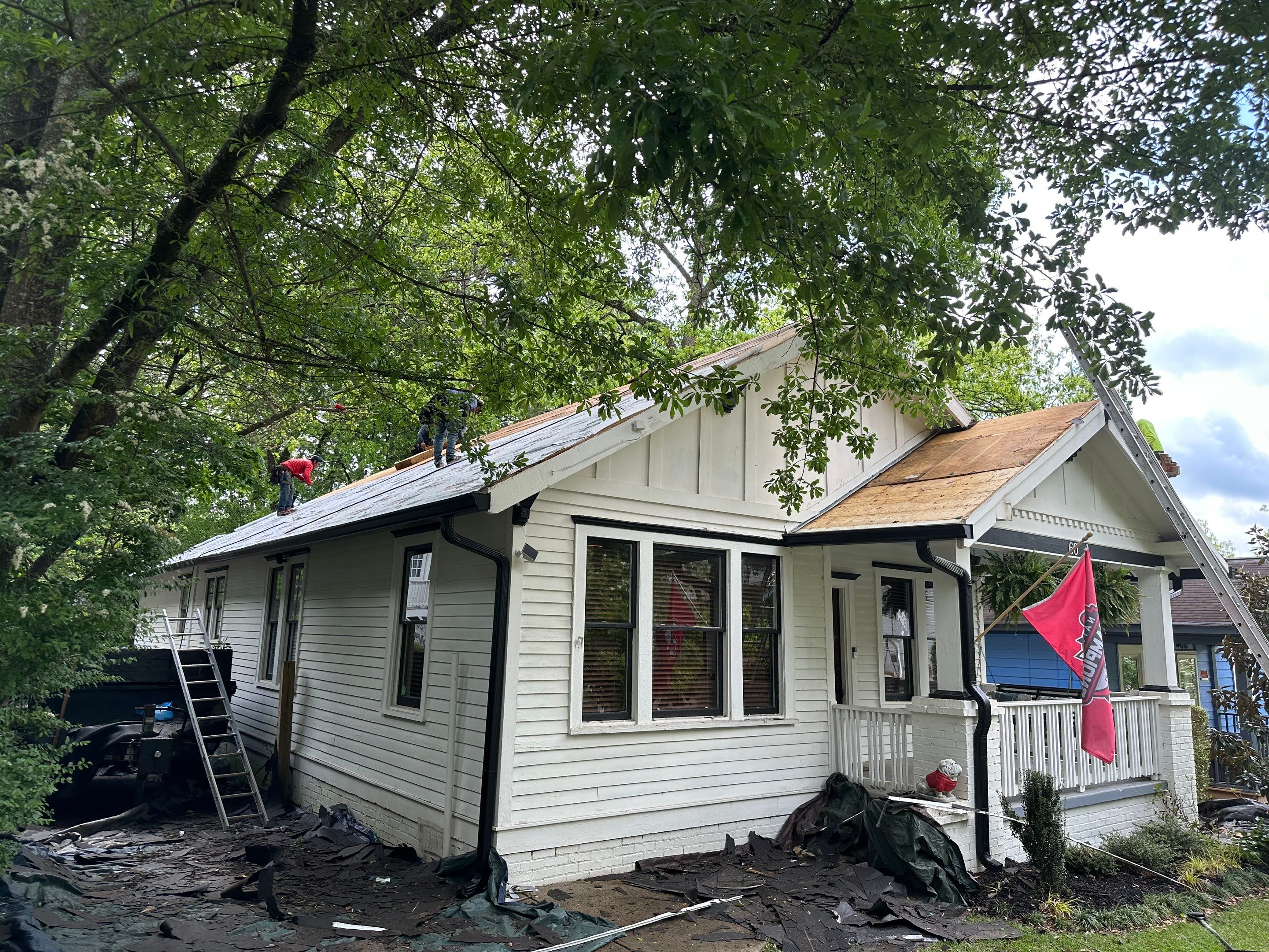 roof replacement and new black gutters by Nailed It Roofing & Remodeling LLC