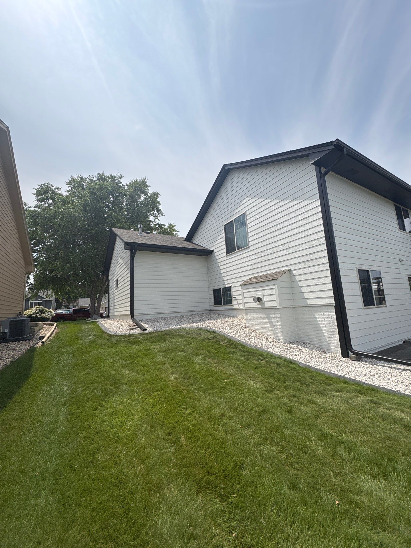 Residential Exterior Painting and Siding Refresh in Sioux Falls by Select Painting, Coatings & Garage Cabinets