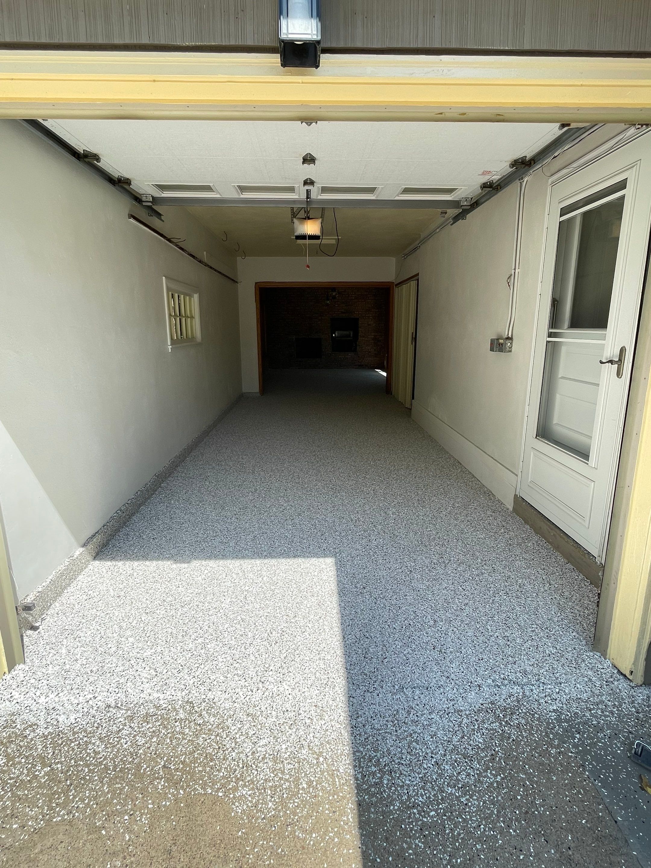 Sioux Falls Garage and Sunroom Concrete Coating with Coyote Flake by Select Painting, Coatings & Garage Cabinets