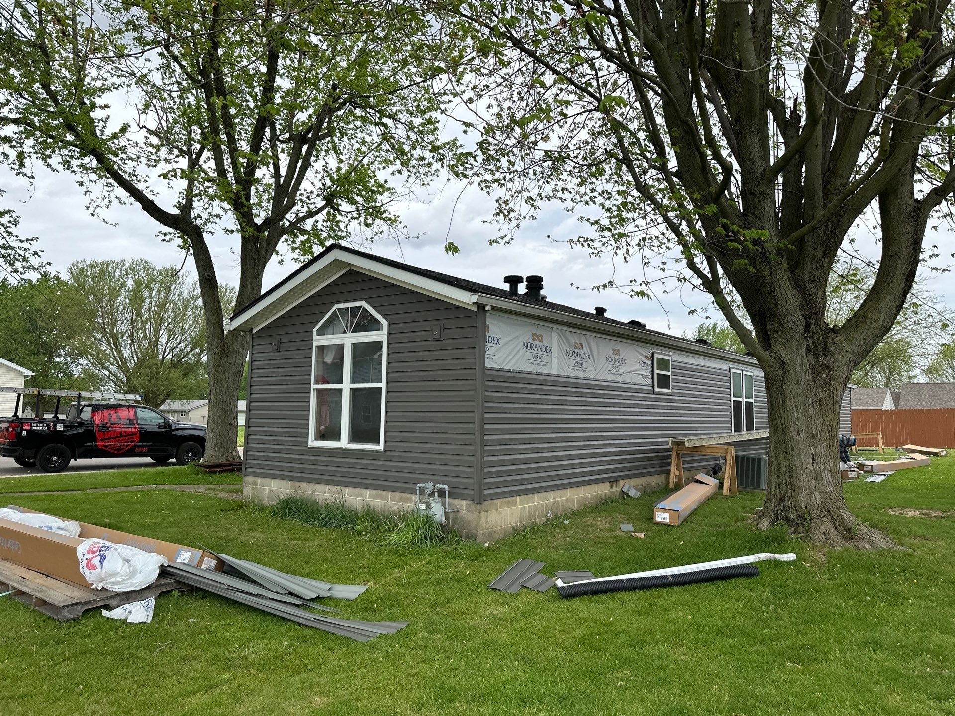 Roof and Siding Replacement using Norandex Cedar Knoll Graphite Siding and Owens Corning Durations in Onyx Black by WIW Enterprises Inc
