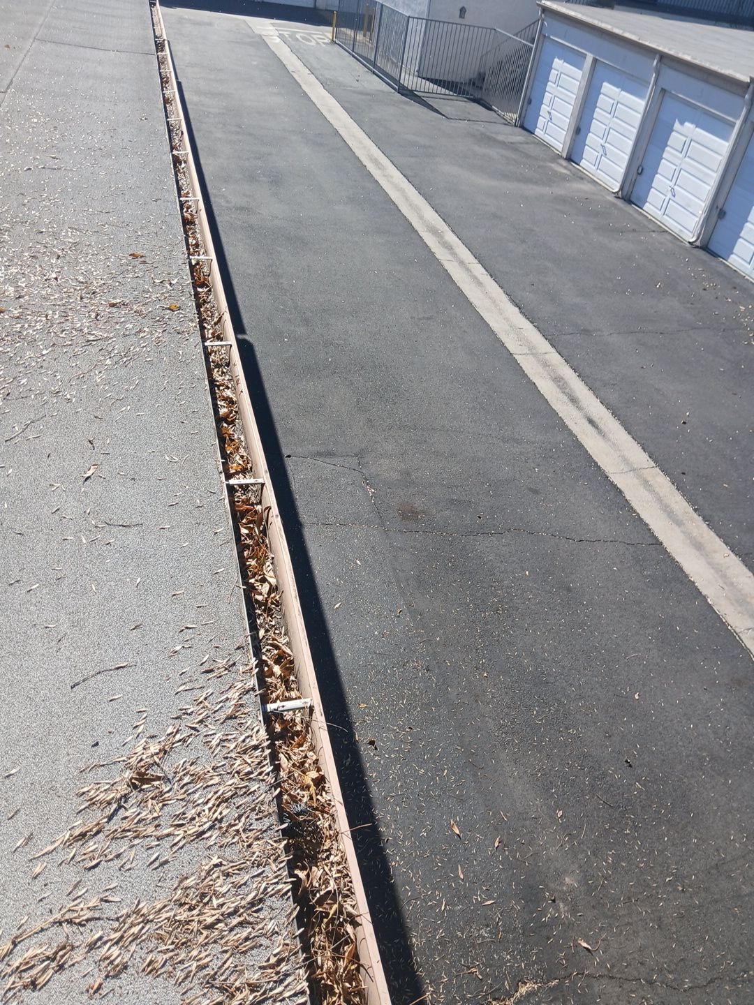 Commercial gutter cleaning Pasadena & San Gabriel Valley, CA before photo with filled gutters