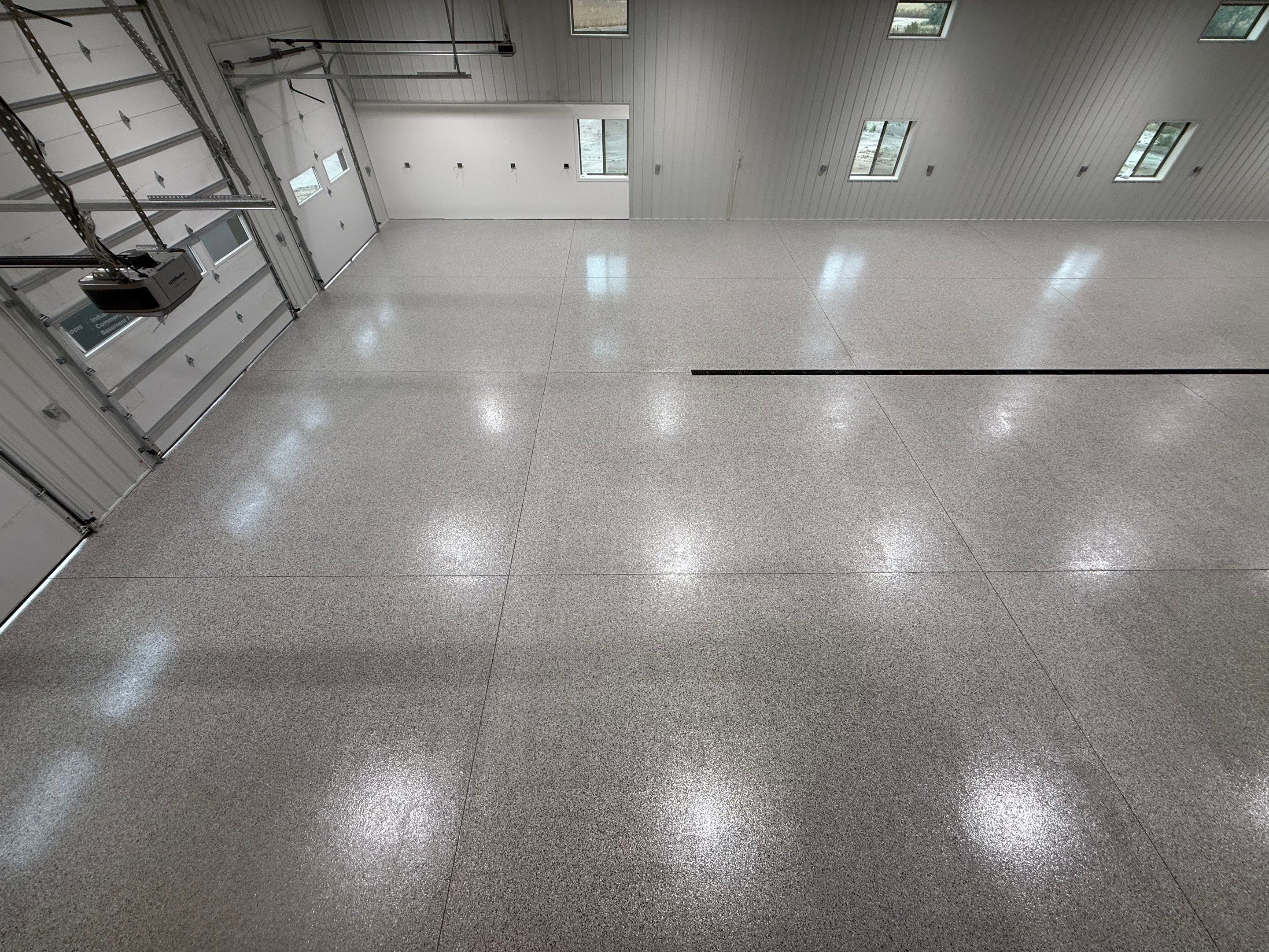 Custom Speckled Floor Coating for Large Montrose Shop by Select Painting, Coatings & Garage Cabinets