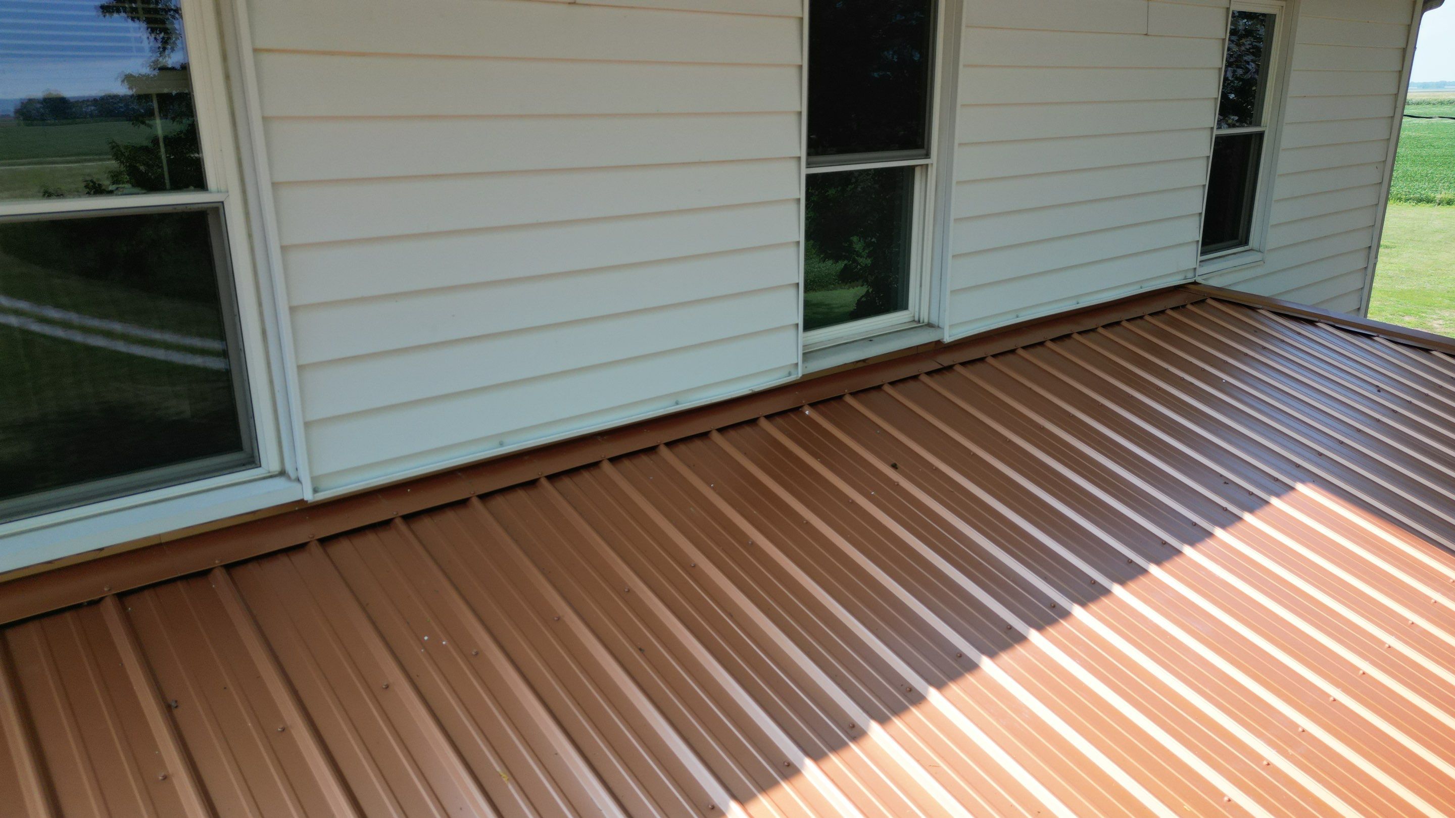 Residential Roofing Installation using Performance Panel Metal - Copper Metallic by RoofX 