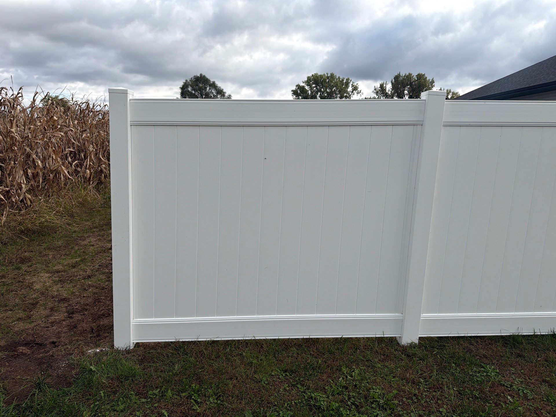 Residential White Vinyl Privacy Fence Installation in Janesville by Perfect Picket Fence and Stain