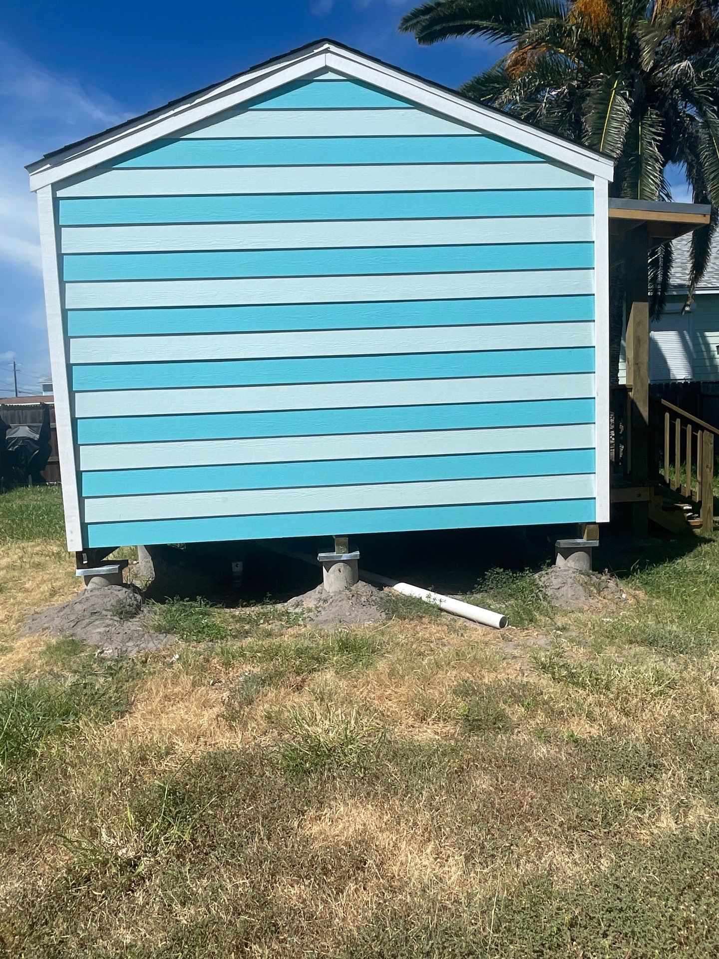 Stripped Beach Bungalow  by Bayfront Roofing and Construction