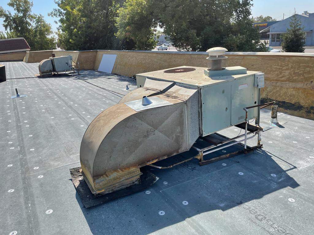 Commercial Roofing Installation using General Coatings acrylic coatings and spray foam by Straight Edge Roofing Inc