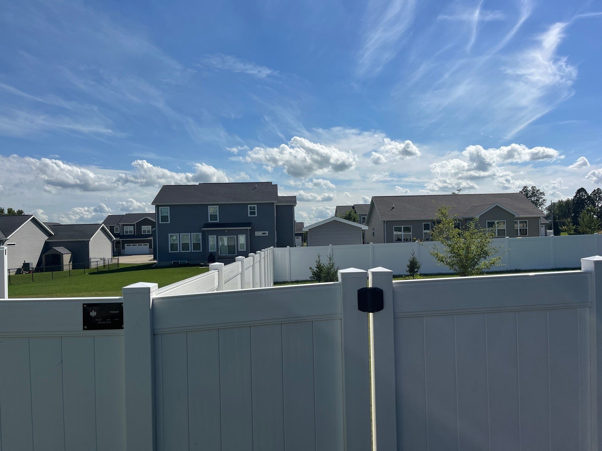 New Vinyl Privacy Fencing and Gates for Waterloo Residential Backyard by Perfect Picket Fence and Stain