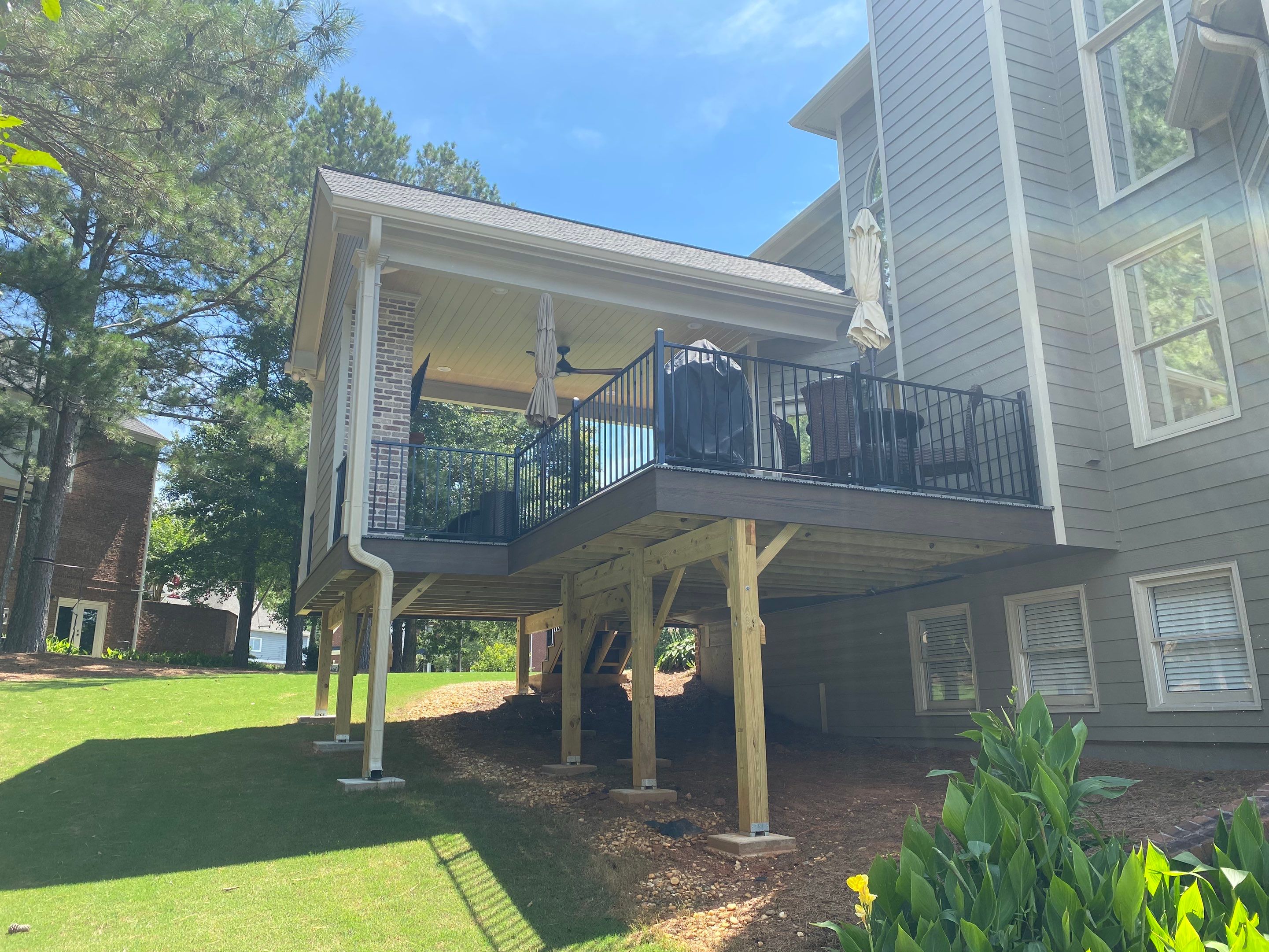 Covered Porch and Composite Deck Addition in Woodstock by Swift Home Renovations