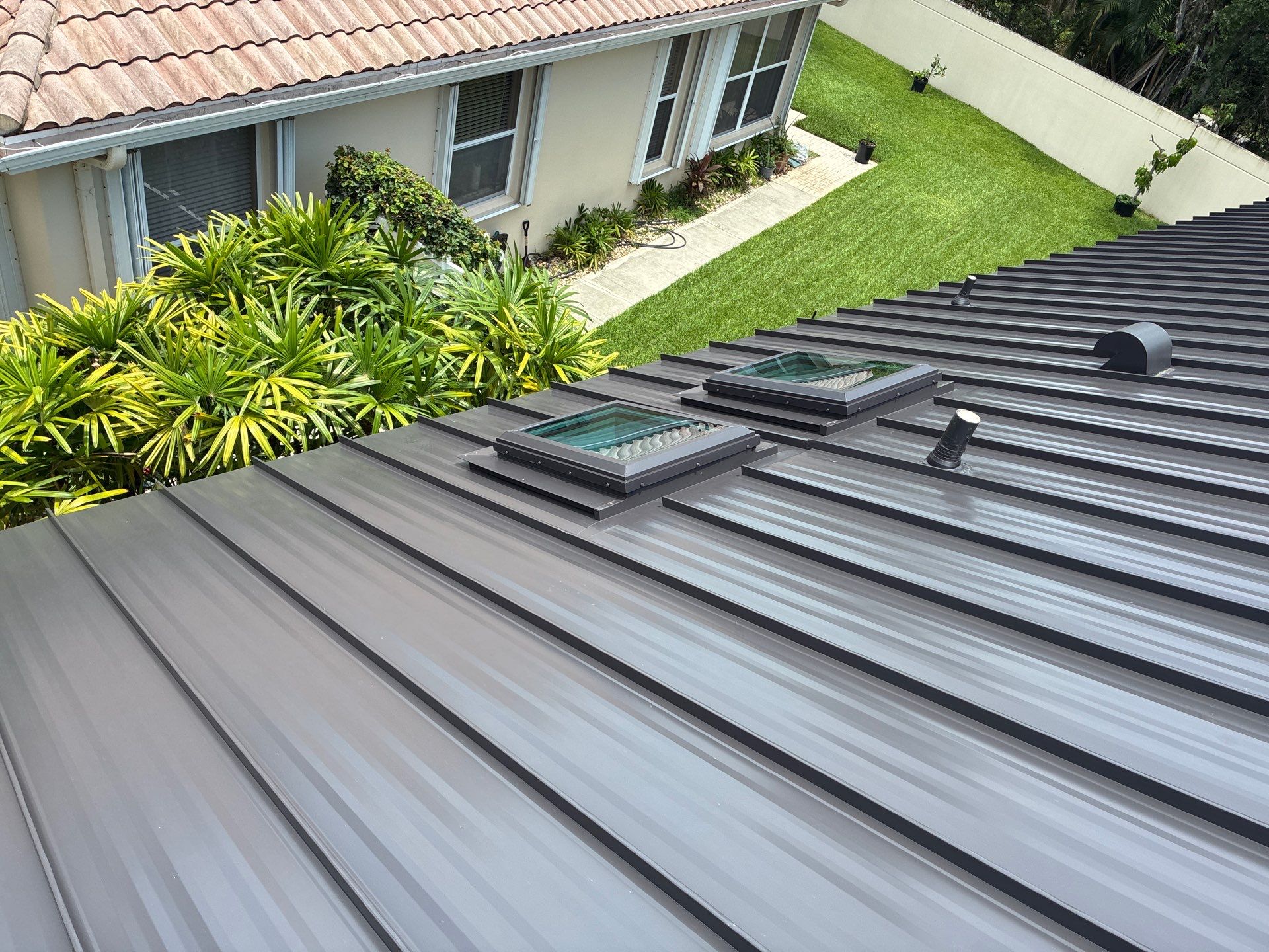 24ga 1.5" Mechanical Seam Dark Bronze by Total Roofing System The Metal Roof Experts