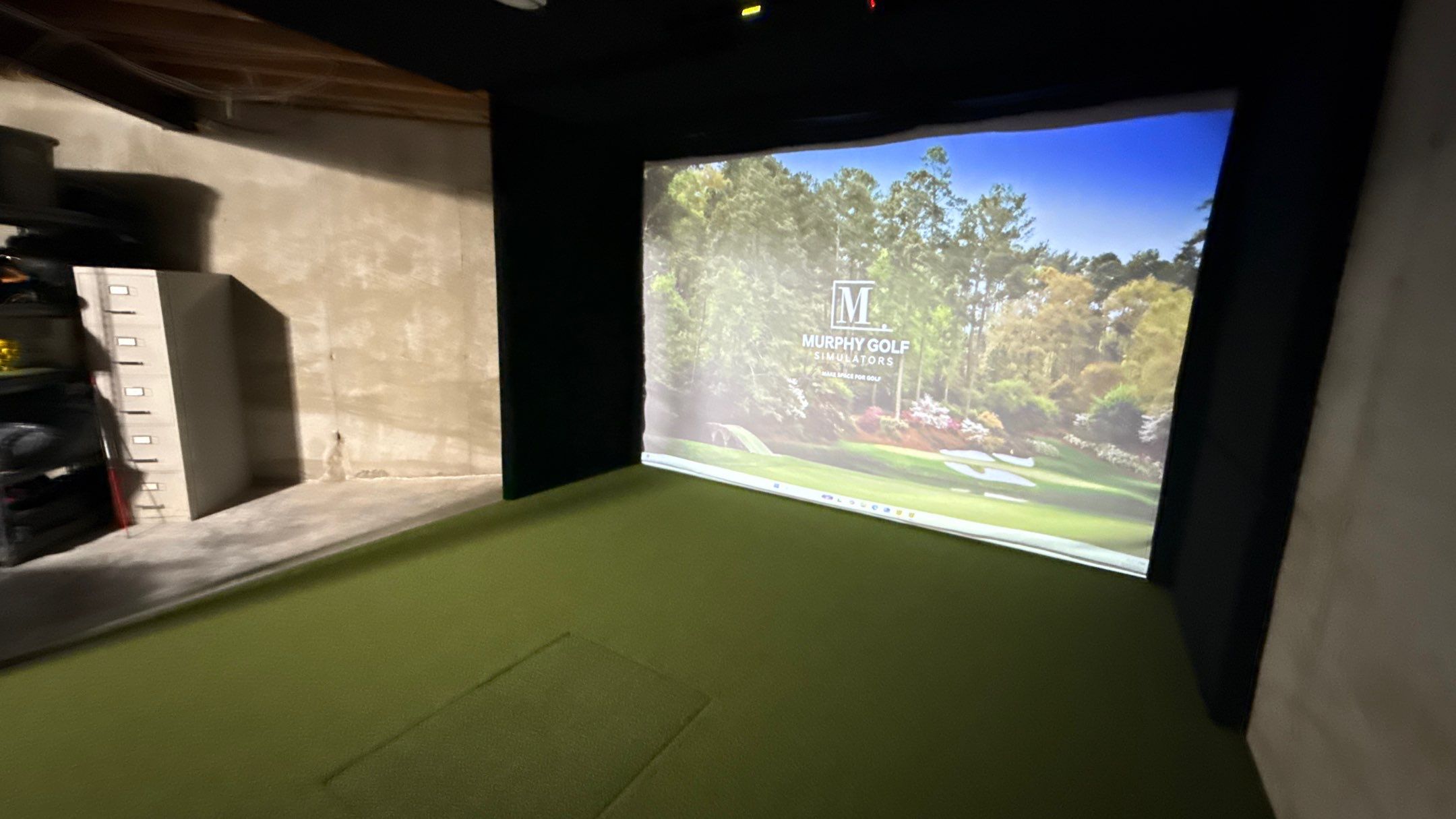 Rex Went With A Custom Golf Simulator  by Banner Garage