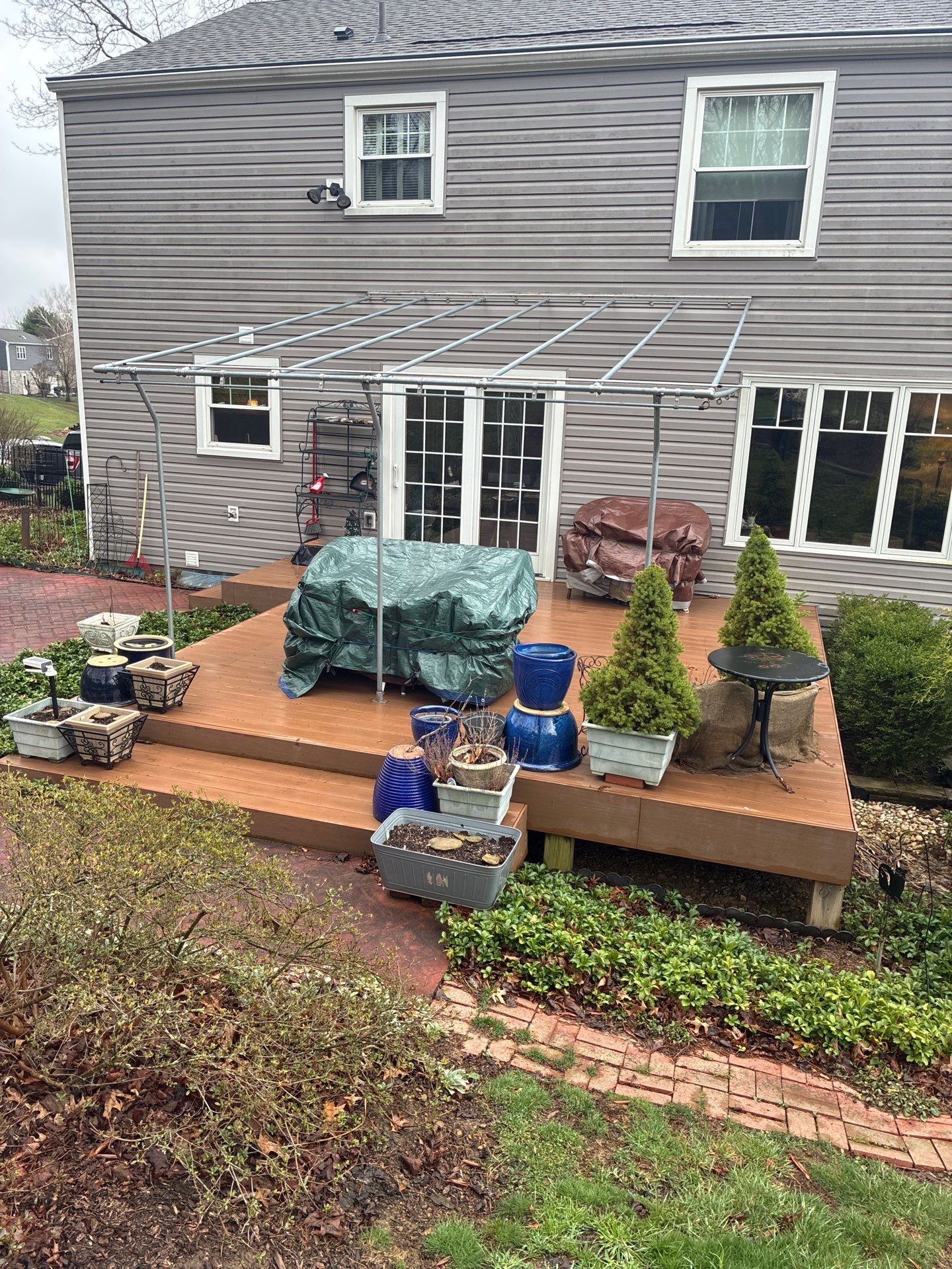 Composite Deck Build with Integrated Patio Cover in Washington by Cousins Roofing Siding & Decks