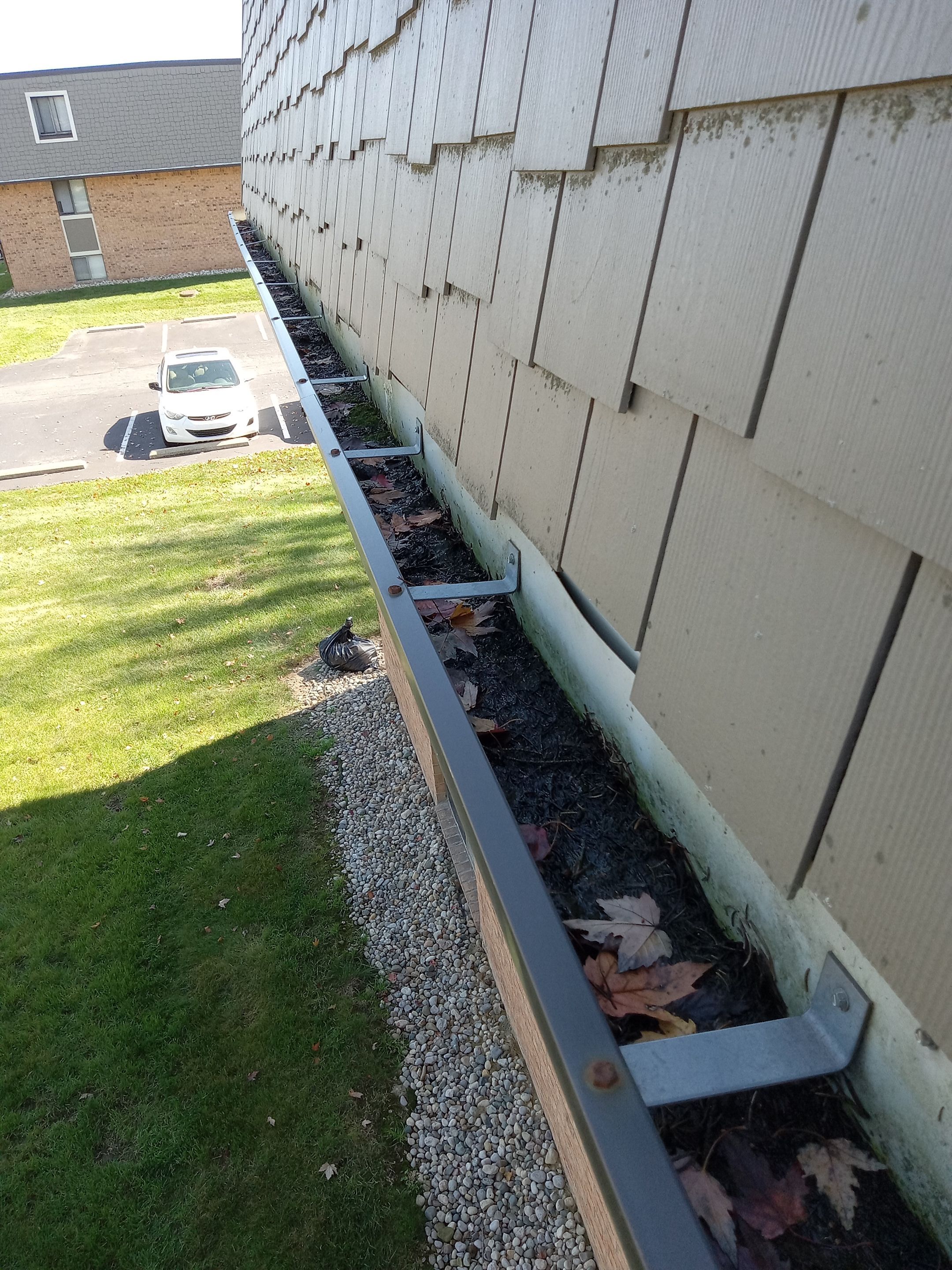 Commercial gutter cleaning Toledo, OH before photo with filled gutters