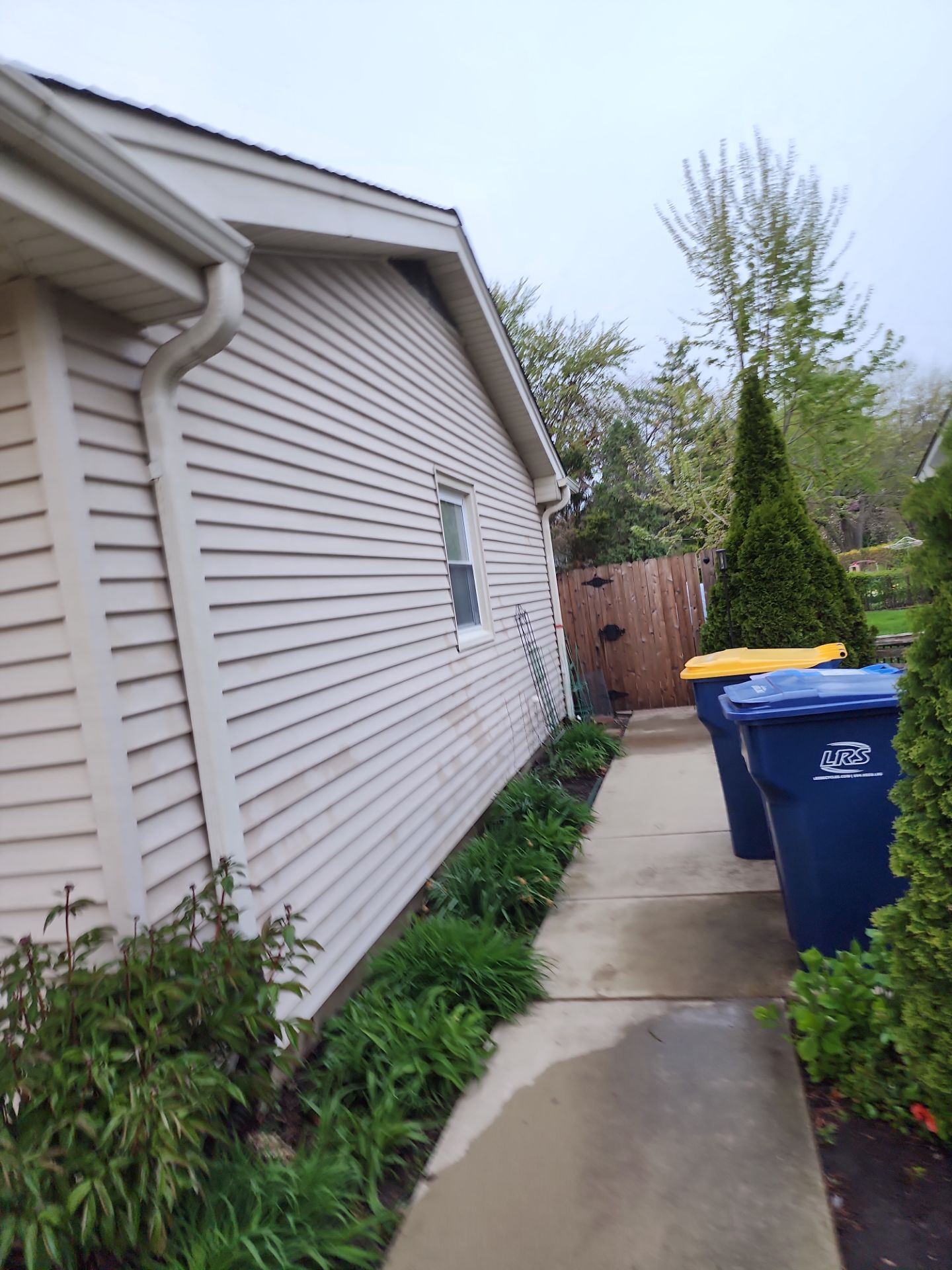 roof washing using Algaecide, soft wash soap by Northern Power Washing LLC.