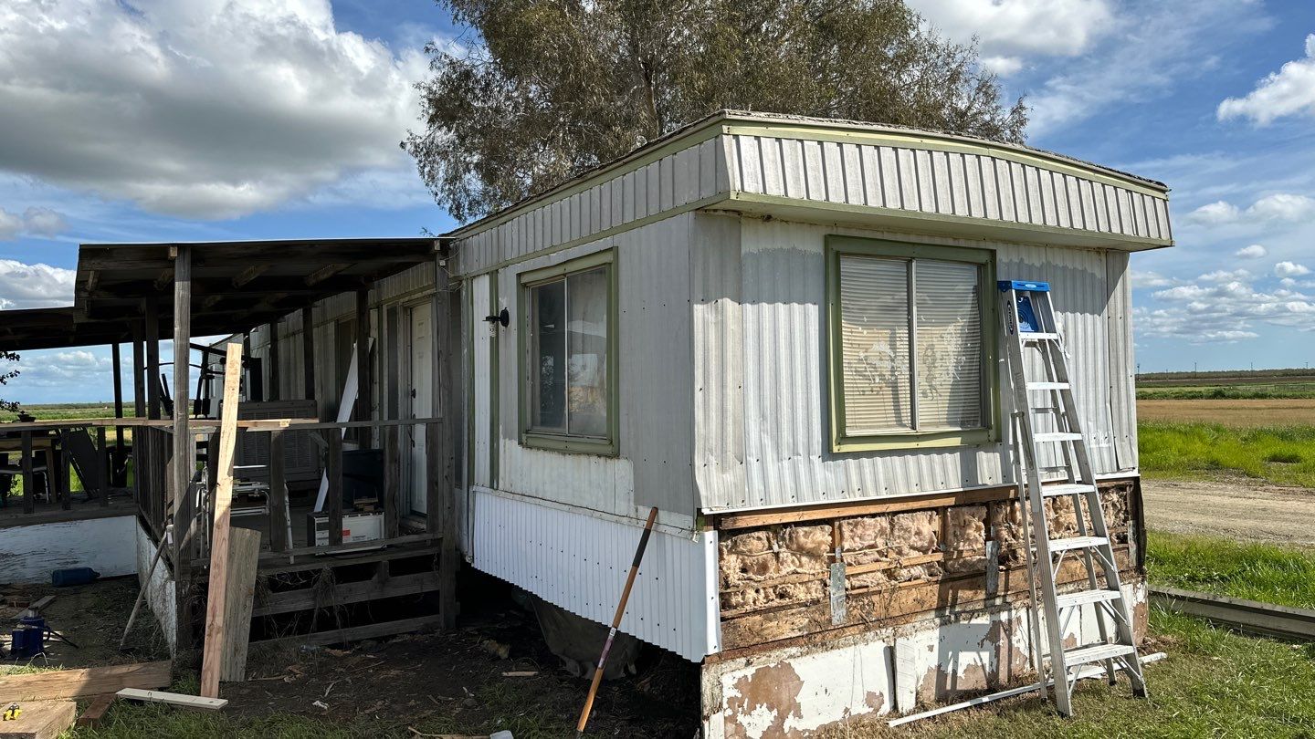 Foam and coatings on mobile home by Straight Edge Roofing Inc