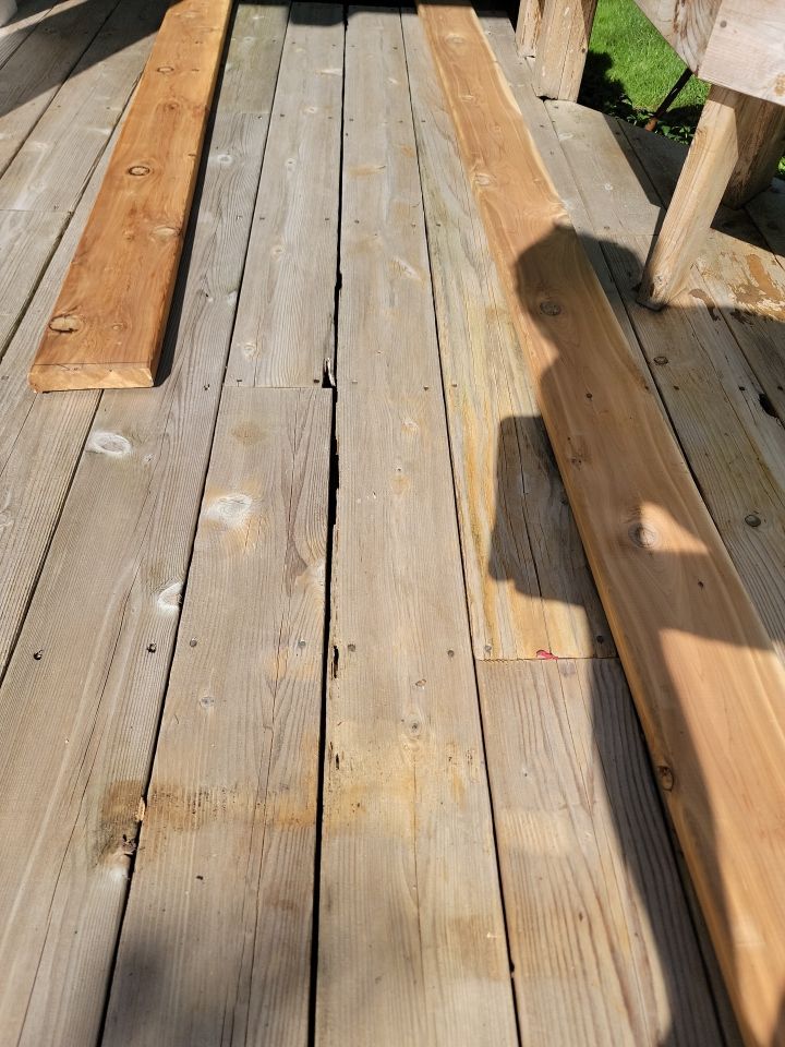 Wood deck cleaning, board replacement and staining by Northern Power Washing LLC.