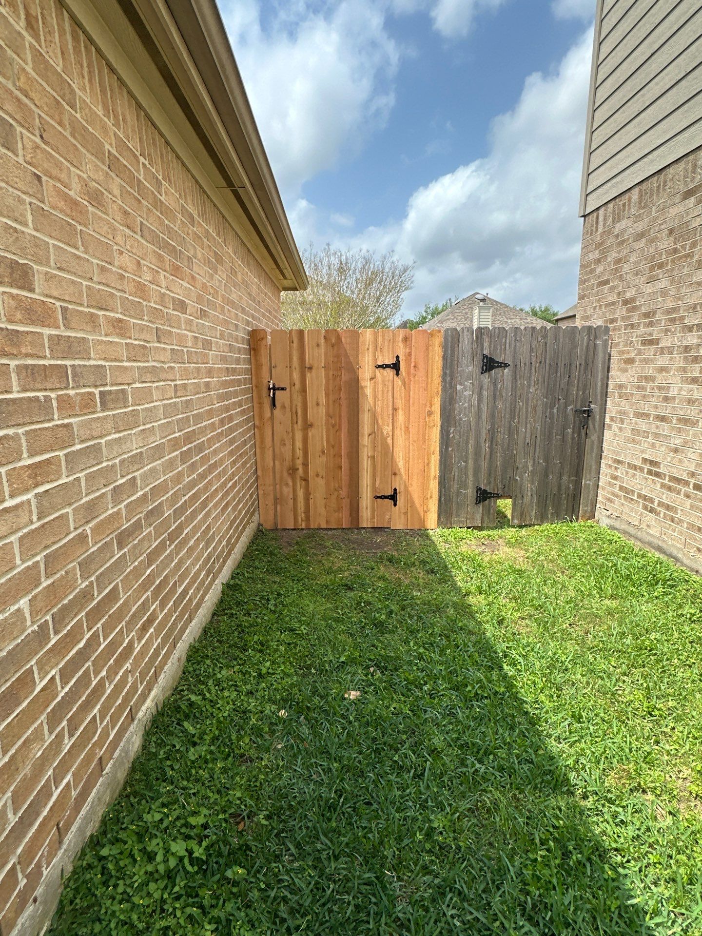 Wood fence with alternating panels by Tim's Fences
