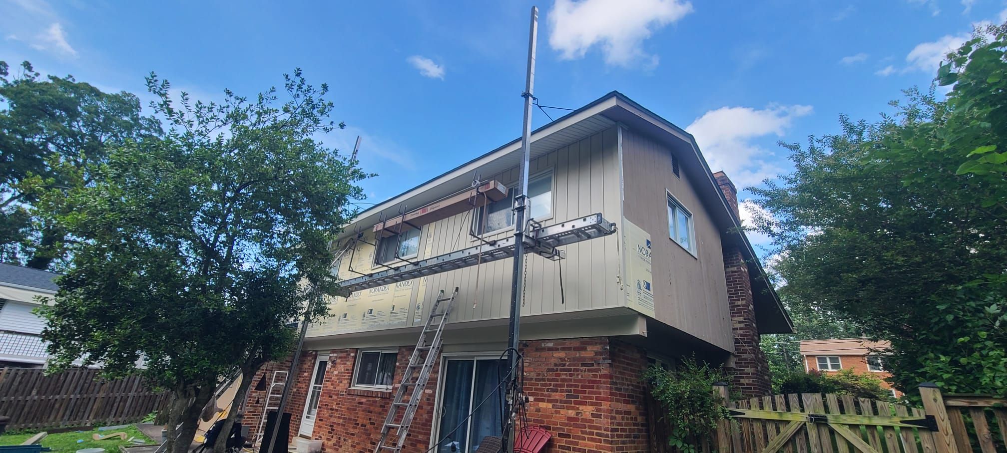 Fairfax: Residential Siding Replacement with CertainTeed 8" Board and Batten Siding in Desert Tan by RM Banning, Inc.