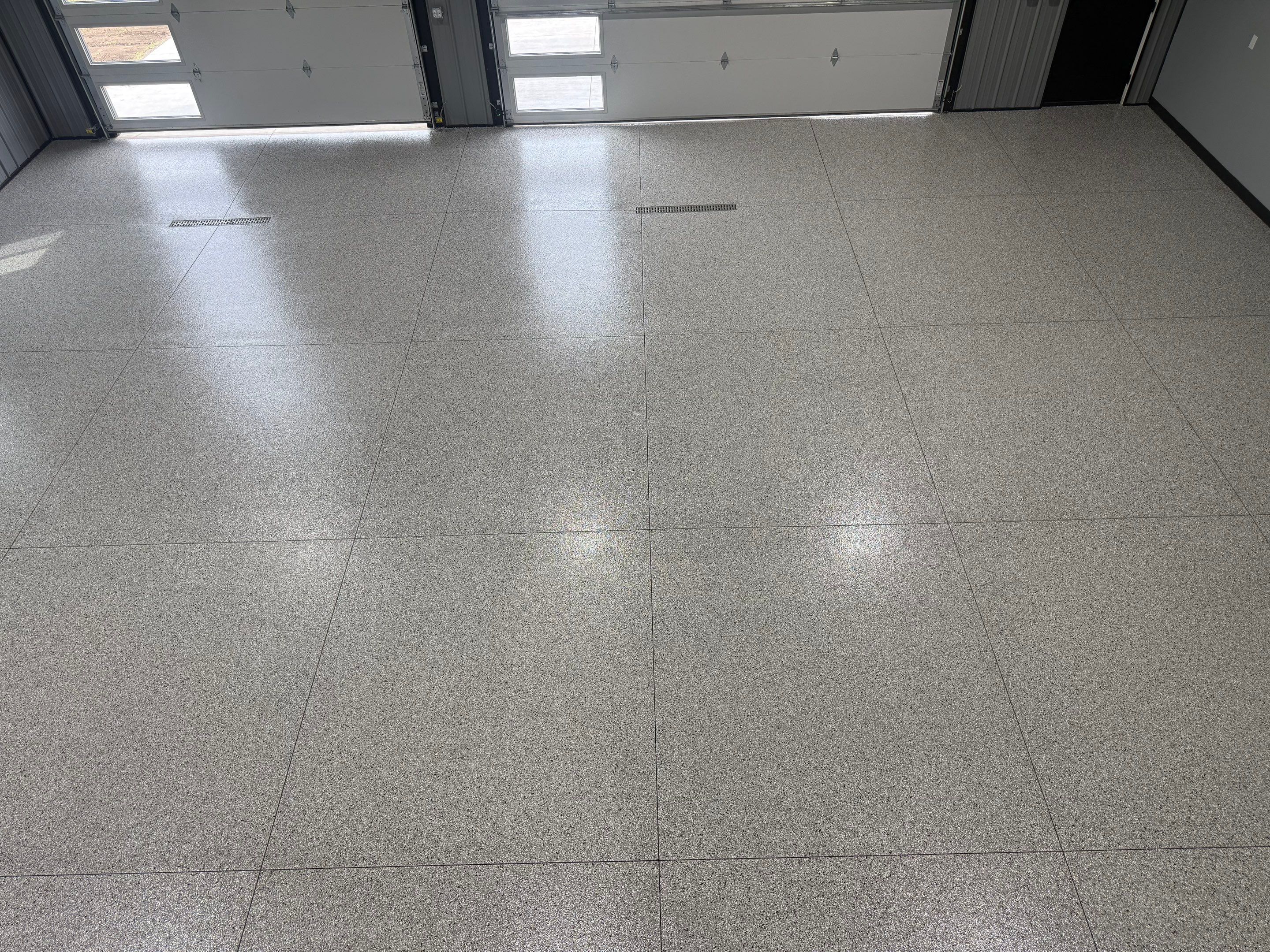 Polyaspartic Garage Floor Coating with Decorative Flake in Wentworth by Select Painting, Coatings & Garage Cabinets