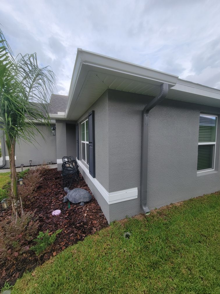 Grey Downspouts Installation in Parrish FL by Gutter Professors