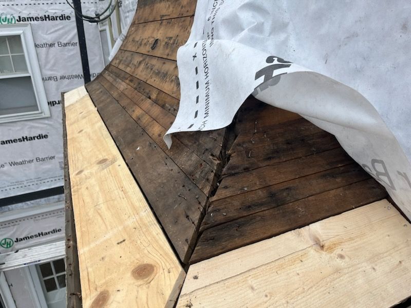 White cedar shingles and windows in Wayland, MA by UBrothers Construction