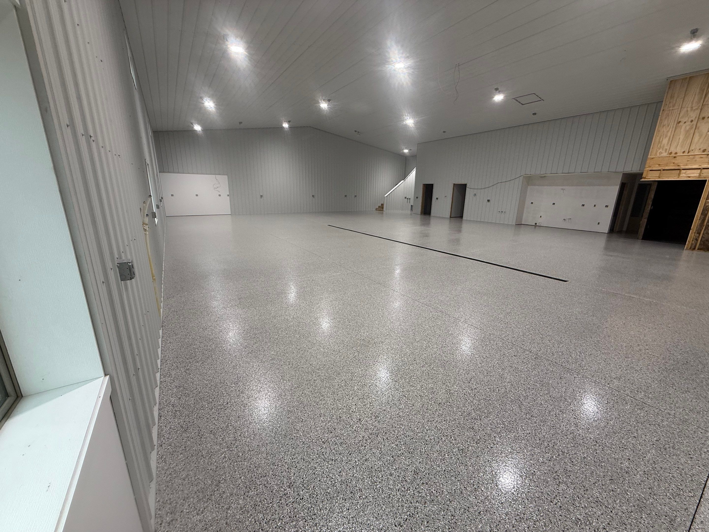 Custom Speckled Floor Coating for Large Montrose Shop by Select Painting, Coatings & Garage Cabinets