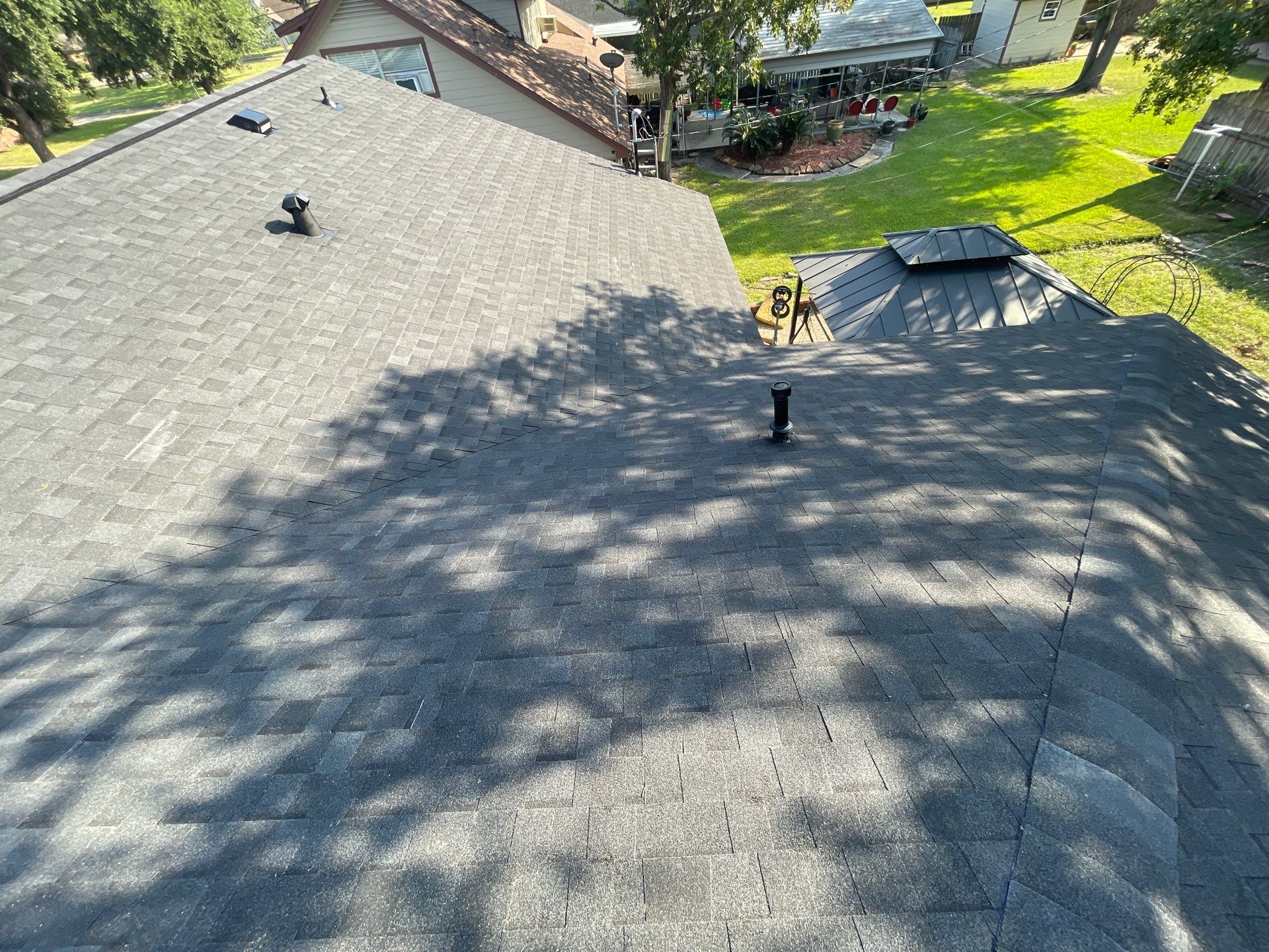 Residential Roofing Installation using Tamko Heritage® Series Rustic Black by CAP Roofing and Construction LLC